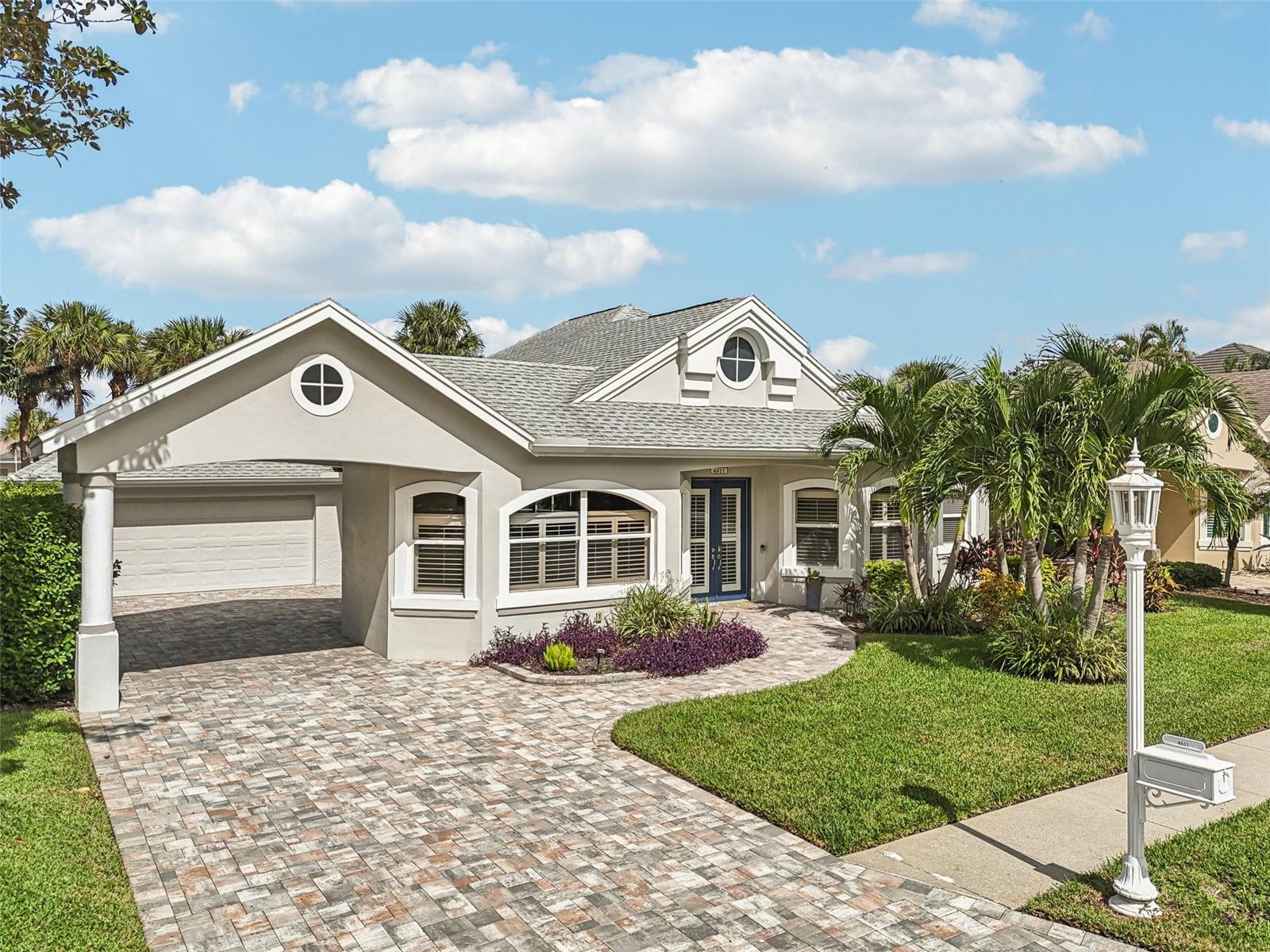 Designed for true boating enthusiasts, this exceptional waterfront residence offers direct Gulf access with no lifts or locks. Positioned on a deep saltwater canal with a generous turning basin, the property features a 61-foot composite dock, a 36x13 covered 10,000-lb boat lift that is easily increased for larger scale boats. Gem remote, electric hook up and integrated lighting—creating the ultimate setup for serious boaters and anglers alike.  Located on a quiet cul-de-sac with no history of flooding, this fully renovated 4-bedroom, 3-bath home blends refined coastal living with modern convenience. Inside, the 2024 designer kitchen is the centerpiece, showcasing quartz countertops, a dual-sided waterfall island, custom cabinetry, a butler’s pantry wall, locally crafted wood range hood, and a premium Ruvati 39" workstation sink. The open floor plan flows seamlessly to the outdoor living space, ideal for entertaining.   The primary suite offers a private retreat with peaceful water views, dual walk-in closets, direct outdoor access, and a spa-inspired bath with a freestanding soaking tub. Throughout the home, you’ll find thoughtful upgrades including large-format 4' ceramic tile flooring, custom built-ins, designer bathrooms with quartz finishes, TOTO bidet toilets, and integrated smart lighting.   Outdoor living is equally impressive with a screened-in pool and spa, updated pavers, and plenty of space to relax or entertain while enjoying expansive sunset views over the canal.   Additional updates include a newer HVAC system (2023), roof (2017), full gutter system, and extensive 2024 renovations with high-end finishes throughout.   Situated in The Inlets at Riverdale, residents enjoy low HOA fees along with access to tennis courts, nature trails, and a community fishing pier.   Just minutes from beaches, dining, and shopping, this move-in-ready home delivers the ideal balance of luxury, comfort, and premier boating access.
