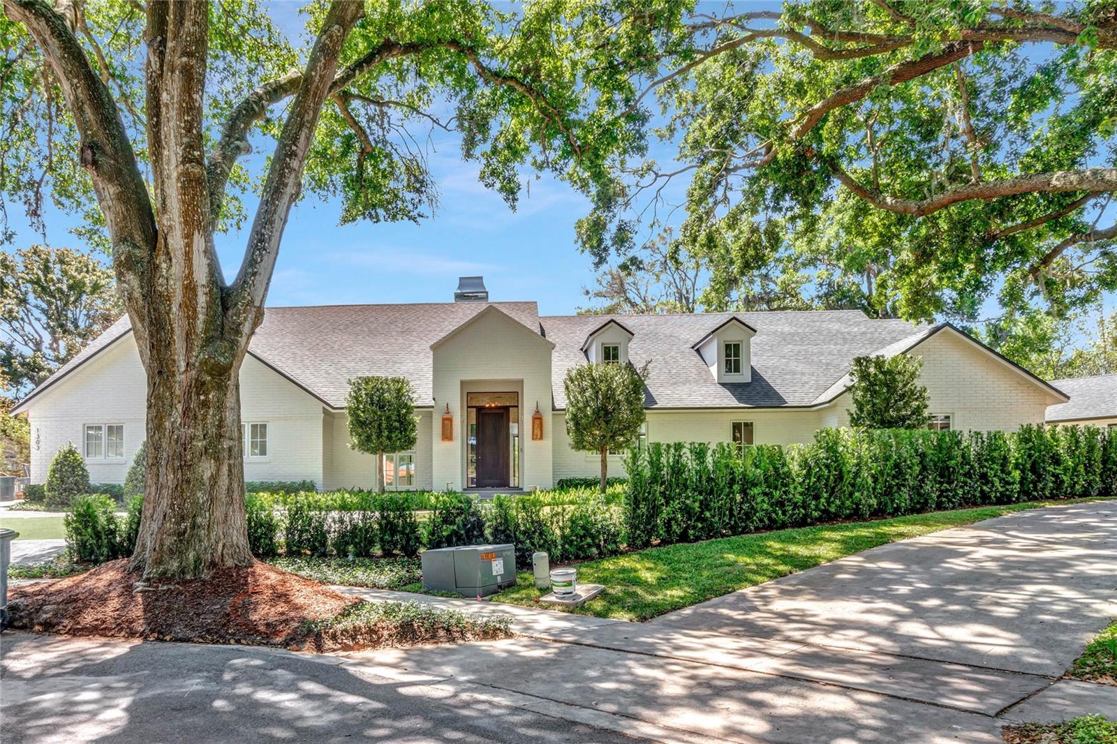 Welcome to this exquisite French Modern home that seamlessly blends classic architecture with modern amenities.  With 4 bedrooms, 4.5 bathrooms, 4,055 s/f, and a detached art studio, this stunning, single story property offers the ultimate in luxury living.

The open floor plan of the main living area effortlessly flows from the gathering room with a cozy fireplace to the dining and sitting room. The kitchen features Wolf, Sub-Zero appliances, custom cabinetry, and a large center island perfect for entertaining guests.

Step outside into this stunning oasis, where every detail has been meticulously designed to create the ultimate in relaxation and entertainment.  With a pool, Casita, fire feature, and summer kitchen, this outdoor space is the perfect retreat for enjoying the warm weather.  The oversized lot extends to another highlight of this home, a separate art studio.  This studio is bathed in natural light and will provide the perfect space for creative pursuits or as an office. 

Located in Winter Park, this stunning French Modern home offers the perfect combination of luxury and functionality.  Don't miss the opportunity to make this your dream home!