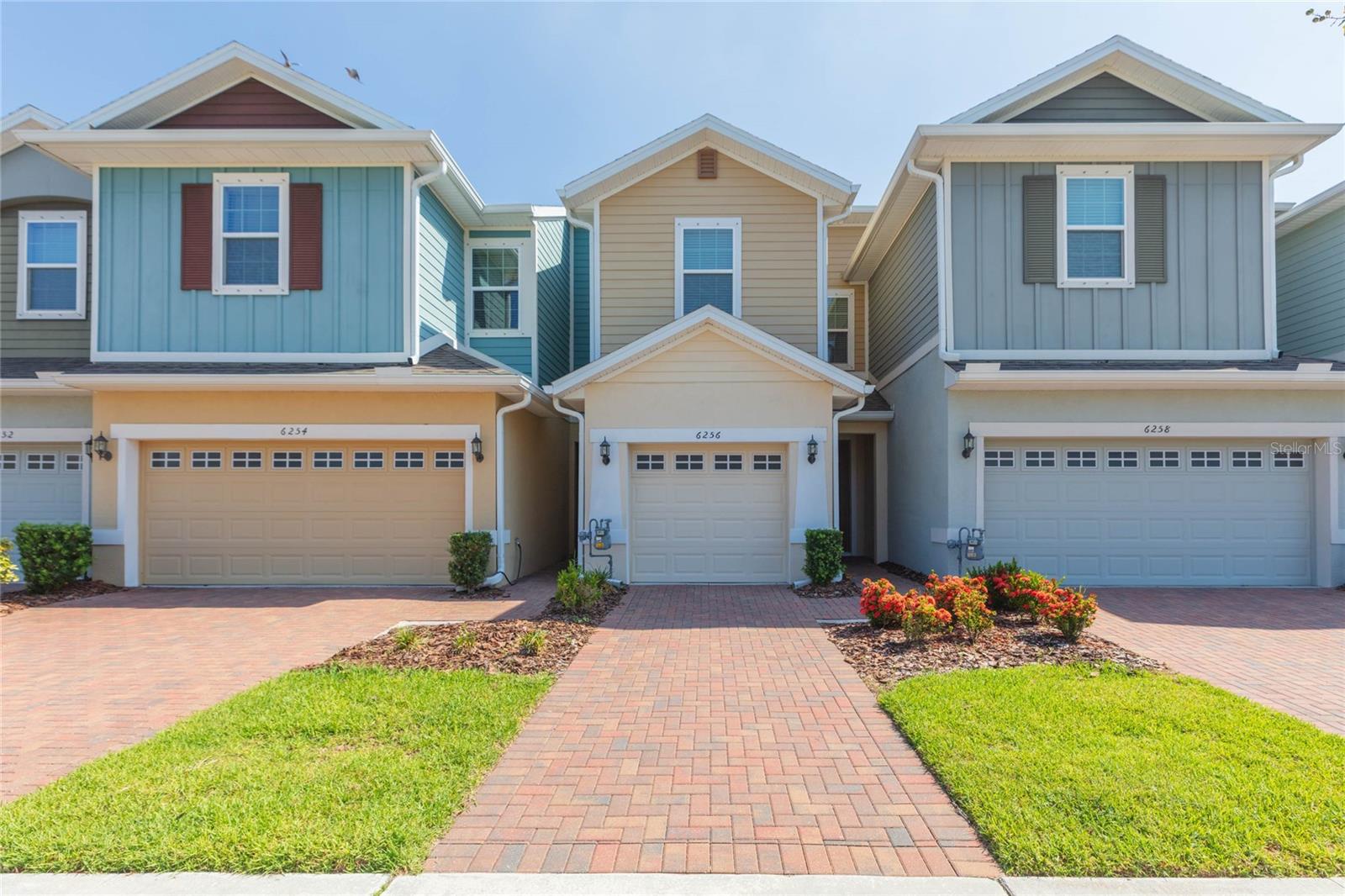 Welcome to the resort-style community of Waterset! Maintenance free living at its finest! This townhome offers a charming exterior with paver driveway, 3 bedrooms, 2.5 baths, and a 1-car garage. The open layout on the main floor boasts a combined living room, dining room and kitchen, complete with a conveniently located half bath. The kitchen has quartz countertops, 42" cabinets with crown molding, stainless steel appliances (with gas range!), center island and pantry closet. Glass sliders open to the screened lanai, ideal for year-round use. Upstairs, the primary bedroom has an ensuite bath with dual sinks, glass enclosed shower and spacious walk-in closet. Both secondary bedrooms share the remaining full bath. Additional features include a water softener, Nest Smart thermostat, and washer/dryer. The community features state-of-the-art clubhouses, 4 pools, a splash pad, 12 miles of biking/walking trails, pickle ball, basketball, tennis and volleyball courts, 2 fitness centers, The Landing and cafe, dog parks, playgrounds, and picnic areas. Proximity to the preK-8th grade York Innovation Academy Charter School and minutes from I-75, HWY-41, and US-301 make for easy commuting into Downtown Tampa, MacDill AFB, visiting the top-rated beaches, and enjoying all of the shopping, dining, and entertainment Tampa Bay has.