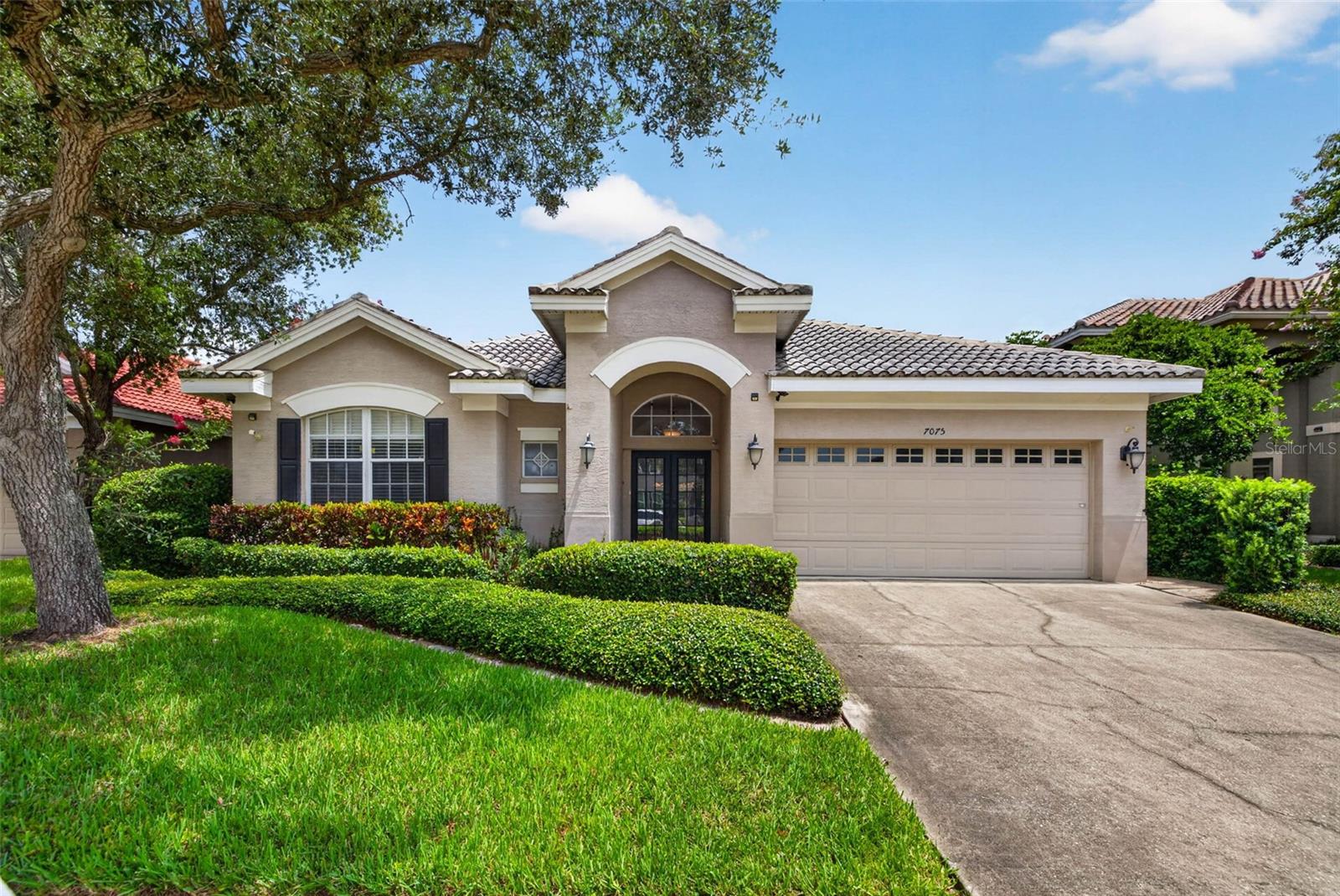 Virtually Staged. Tucked away on a quiet cul-de-sac in a beautifully maintained deed-restricted community of just 35 homes. With sidewalks throughout, a welcoming neighborhood feel, and a location convenient to shopping, restaurants, Publix, Sam's Club, major interstate access, the Gulf beaches, and both Tampa International and St. Pete-Clearwater airports, this home offers an incredible opportunity to create your dream space. Offering over 2,100 square feet, this 3-bedroom, 2-bath split floor plan features soaring vaulted ceilings, generous living spaces, and a layout designed for both everyday living and entertaining. Double front doors open to a welcoming foyer with views through to the screened lanai. The spacious kitchen overlooks the family room and breakfast nook, offering abundant cabinetry, granite countertops, stainless steel appliances, a large pantry, and an adjacent indoor laundry room. The private primary suite is tucked away at the rear of the home and features sliding glass doors to the backyard, dual walk-in closets, separate vanities, a garden tub, and a walk-in shower. Two additional bedrooms and a full guest bath are located on the opposite side of the home, creating a functional split-bedroom layout. Step outside to the screened lanai and fully fenced backyard with mature landscaping, reclaimed water for irrigation, and plenty of room to personalize the outdoor space.  This home presents a fantastic opportunity for buyers looking for a blank canvas with brand new interior paint. While much of the home retains its original finishes, the solid layout, beautiful neighborhood, and overall potential provide the perfect foundation to renovate and make it your own. Additional highlights include fully paid-off solar panels at closing that help offset the majority of the electric bill, a tile roof, and a home located in a non-flood zone.