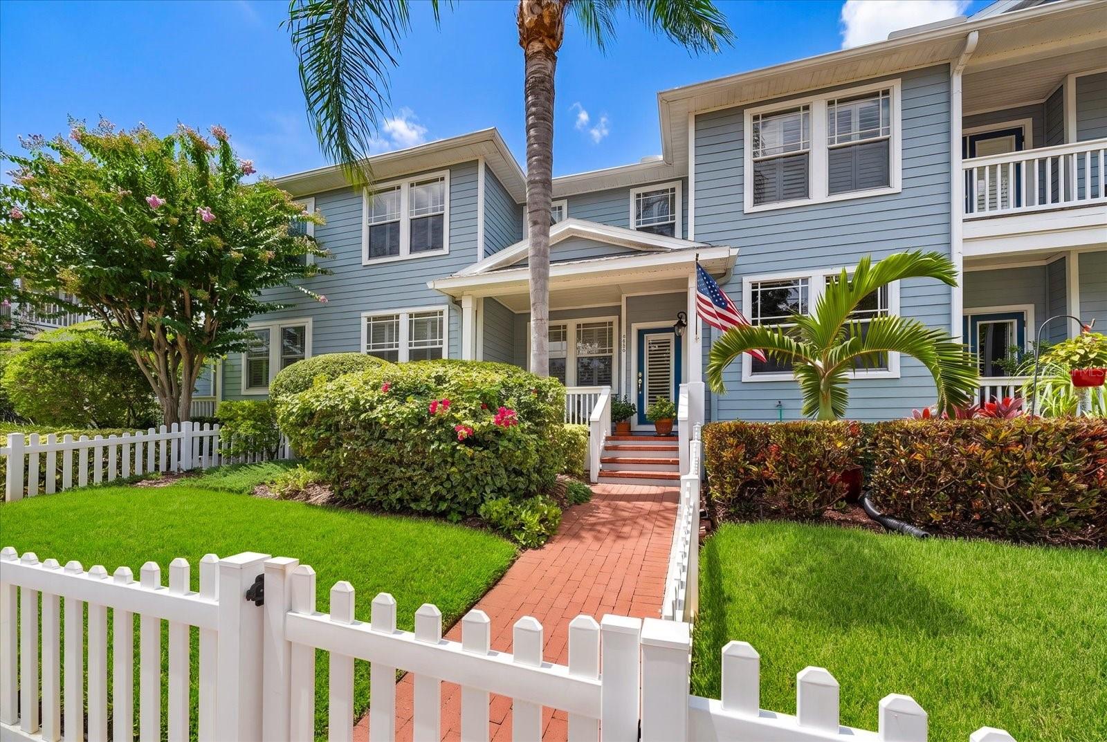 Welcome to West Bay Village, an upscale, pet-friendly executive townhome community nestled in the heart of Largo's Historic District. With charming white picket fences, vintage streetlights, brick-paved streets, and beautifully manicured landscaping, this picturesque neighborhood offers timeless curb appeal and an exceptional lifestyle.
This beautifully maintained 3-bedroom, 2.5-bath townhome radiates warmth and character from the moment you arrive. Follow the brick walkway through the private fenced yard to the inviting covered front porch—an ideal place to enjoy your morning coffee or relax in the evening.
Step inside to a spacious, light-filled floor plan featuring 9-foot ceilings, crown molding, plantation shutters, rich wood flooring in the living and formal dining rooms, and abundant natural light. Designed for both comfortable everyday living and effortless entertaining, this home is truly move-in ready.
The well-appointed kitchen is the heart of the home, offering 42-inch cabinetry, a breakfast bar, generous counter space, newer SS LG appliances, and a large walk-in pantry. Adjacent to the kitchen, the elegant formal dining room showcases a tray ceiling and chair rail, creating the perfect setting for family gatherings and holiday dinners. A conveniently located half bath completes the first floor.
Upstairs, the thoughtfully designed split-bedroom floor plan provides privacy for everyone. The expansive primary suite features a huge walk-in closet and a luxurious ensuite bath with dual vanities, a relaxing garden tub, separate shower, and private water closet. Two additional spacious bedrooms, each with large walk-in closets, share a full bath. An oversized laundry room with washer, dryer, utility sink, and shelving add everyday convenience.
Storage is abundant throughout the home, including the oversized two-car garage with an enormous storage closet and plenty of room for a workshop, bicycles, golf cart, or recreational gear. Outside, enjoy your private fenced yard and welcoming front porch.
West Bay Village offers one of Largo's most walkable locations. Just two blocks away, Ulmer Park hosts farmers markets, concerts, and community events throughout the year. You'll also enjoy easy access to Publix, shopping, restaurants, medical facilities, Largo Central Park, the Performing Arts Center, the Pinellas Trail, dog parks, post office, playgrounds, volleyball courts, movie theaters, and top-rated schools.
Exciting new development is underway just blocks away with the upcoming Largo Entertainment District, including Horizon West Bay, Largo's new City Hall, Liberty Yards, boutique shopping, restaurants, and cafés.
Best of all, you're only five minutes from the Belleair Bridge and the sparkling Gulf beaches, where you'll enjoy soft sand, turquoise waters, waterfront dining, boutique shopping, and breathtaking sunsets.
No flood insurance required! Situated approximately 70 feet above sea level and not located in a flood zone, this exceptional home combines luxury, convenience, and peace of mind in one of Largo's most desirable communities.