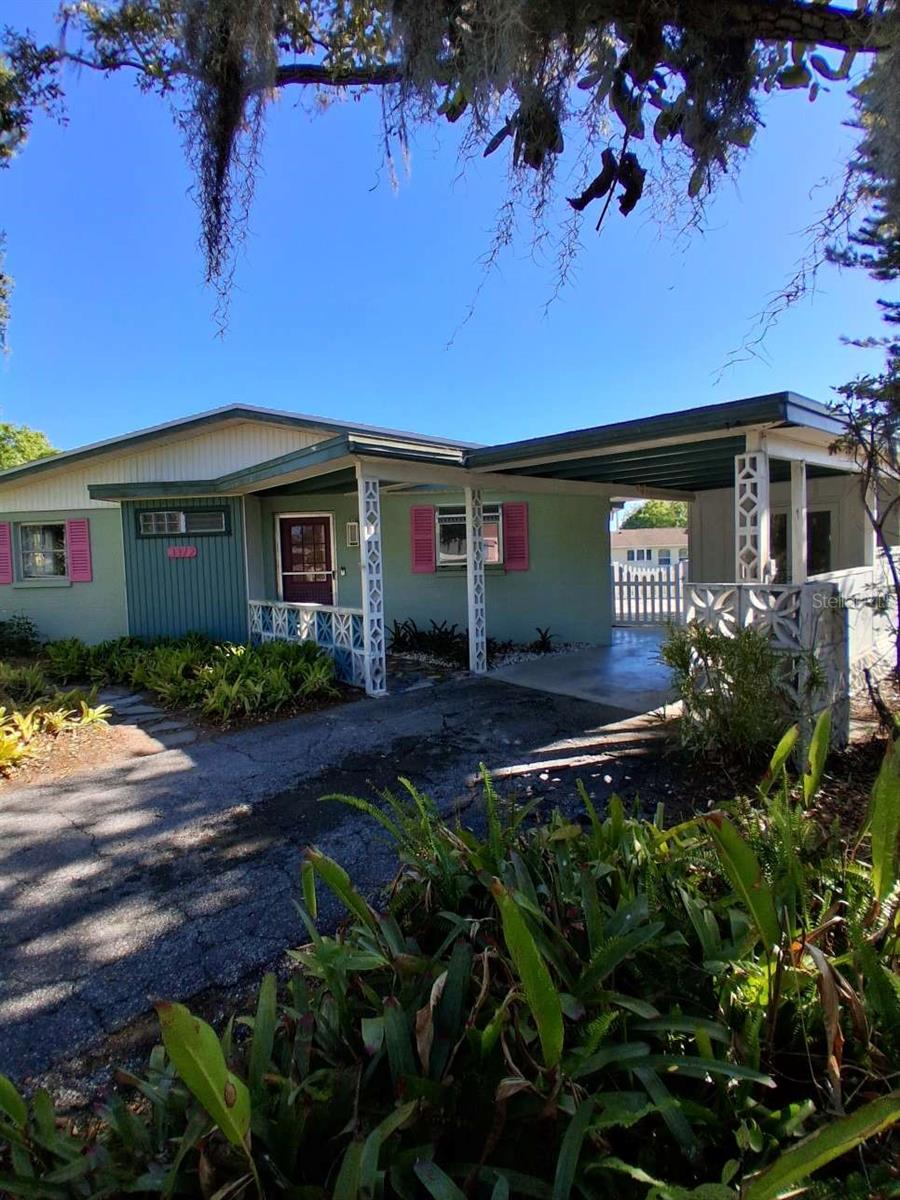Custom designed and designed and built in 1963, this concrete block home has stood the test of time and durability.  The beach on Siesta Key is only 15 minutes away..  This is the lowest priced home listed in Shadow Lakes during the last two years.  Shadow lakes is a neighborhood of upscale homes on oversize lots in the north end of Gulf Gate. Most of the homes in the neighborhood, including this one, are on the series of ponds/preserves separating backyards of the  homes.  Adding to peace of mind for the new owner is a new roof that was completed March 2026.   The kitchen was recently remodeled to a high standard.  The separate laundry room off the carport includes a half bath.  The well-built storage shed measures approximately 10ft x 10ft.  Among the pictures you can view the large fenced patio area that encompasses the shed as well as an outdoor shower area concealed between the laundry room and shed.