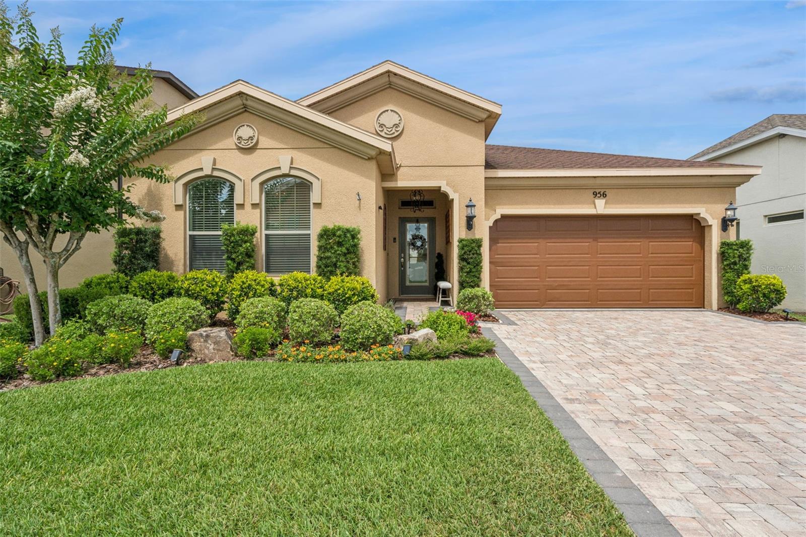 Located in the sought-after Reserve at Minneola, this immaculately maintained 3-bedroom, 2-bath home offers stylish finishes, functional living spaces, and an unbeatable location in the heart of one of Central Florida's fastest-growing communities. Beautiful curb appeal welcomes you home with manicured landscaping and a paver driveway. Inside, the open floor plan creates an easy flow between the family room, dining area, and kitchen, making the home equally suited for everyday living and entertaining. The kitchen is designed to impress, featuring granite countertops, stainless steel appliances, custom cabinetry with under-cabinet lighting, and a large island with breakfast bar seating and pendant lighting. Luxury vinyl plank flooring extends throughout the main living areas and bedrooms, offering both durability and style. The spacious primary suite provides a relaxing retreat with a tray ceiling in the bedroom, walk-in closet, and an en suite bath with dual vanities and a walk-in shower. The third bedroom offers flexibility to fit your needs and could easily serve as a home office, den, or additional guest space. Step outside to enjoy the private, fenced backyard designed for relaxing and gathering. A covered patio overlooks a paver patio featuring a covered seating area and fire pit—perfect for enjoying Florida's outdoor lifestyle year-round. The 2-car garage has been upgraded with high-end sealed acrylic flooring, combining practicality with a polished touch. Enjoy two community pools and a prime location near schools, shopping, dining, medical facilities, the Minneola Athletic Complex and the Florida Turnpike. This home puts you right in the center of Minneola's continued growth and convenience while offering the sense of community that makes the Reserve at Minneola so desirable. *Aerial photo property lines are an estimate and to be verified by buyer.