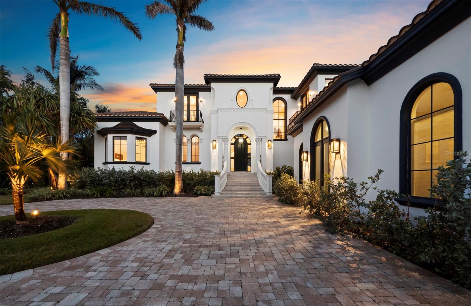 ACCEPTING BACK UP OFFERS.  Sleek. Sophisticated. Effortlessly Luxurious. This completely reimagined Bay Isles Harbor residence is a stunning example of minimalist elegance, where clean lines, impeccable craftsmanship, and Restoration Hardware’s exquisite furnishings create a space that blends everyday comfort with innovation. Step inside to an open, airy layout filled with natural light, where each detail from designer lighting to high-end appliances has been meticulously selected for beauty and function. Spanning 6,556 square feet of living space on an oversized corner lot, the home’s interior features four expansive bedrooms, a study, executive office, a state-of-the-art fitness room, golf simulator and three car garage with private back entrance. The true showstopper? Your outdoor oasis, where an infinity-edge pool melts into the waterway, creating a mesmerizing fusion of sky and sea. From hosting friends to savoring a quiet sunrise, every inch of this home is crafted for the extraordinary. With your boat privately docked just behind your home, adventure is always within reach whether it’s a quick cruise to a waterfront restaurant or a sunset sail on the Bay. Beyond the privacy of Bay Isles’ gated community, the best of Longboat Key is just minutes away. Indulge in world-class amenities at the new St. Regis Resort, or stock up on essentials at Publix in Bay Isles all effortlessly convenient. For beach lovers, exclusive access to the Bay Isles Beach Club or the Longboat Key Club (with membership) ensures that pristine white sands are never more than five minutes from your door. Every inch of this home is gorgeous, curated, and move-in ready offering a sophisticated waterfront lifestyle that is truly unmatched.