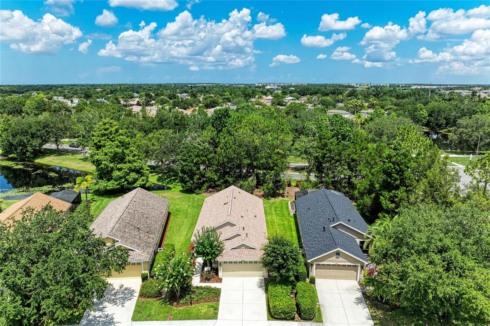 Updated, private, and perfectly positioned in one of Lakewood Ranch’s most desirable school zones, this 3-bedroom plus den home offers the kind of location, lifestyle, and peace of mind buyers wait for. With a 2024 roof, renovated kitchen and bathrooms, low $125/year HOA, natural gas, and a private green-space backdrop on a quiet dead-end street, 6308 Robin Cove delivers incredible value in the heart of Lakewood Ranch.

This is the kind of home where everyday life feels a little easier. Start your morning with coffee out back, surrounded by mature trees, privacy, and peaceful natural views. Spend quiet evenings on the lanai watching the backyard come alive, or take advantage of the location and walk over to Adventure Park, where you can enjoy the dog park, playgrounds, trails, outdoor fitness areas, and a true sense of community. From peaceful mornings at home to active afternoons along the trails and green spaces, this home captures the reason so many people choose the Florida lifestyle.

Inside, vaulted ceilings create an open and inviting feel, while the renovated kitchen features updated cabinetry, countertops, and newer appliances. The bathrooms have also been thoughtfully updated with refreshed cabinetry, countertops, and tile, giving the home a clean, modern, and comfortable finish throughout.

The flexible floor plan includes three bedrooms plus a den, offering the perfect setup for a home office, guest room, playroom, or potential fourth bedroom. Additional highlights include a tankless water heater, natural gas community, no flood zone designation, and one of the lowest annual HOA fees in Lakewood Ranch.

Located just minutes from Lakewood Ranch Main Street, shopping, dining, movies, parks, trails, and everyday conveniences, this home offers the rare combination of privacy, updates, schools, and location in one of Lakewood Ranch’s most established and desirable communities.One or more photos virtually staged