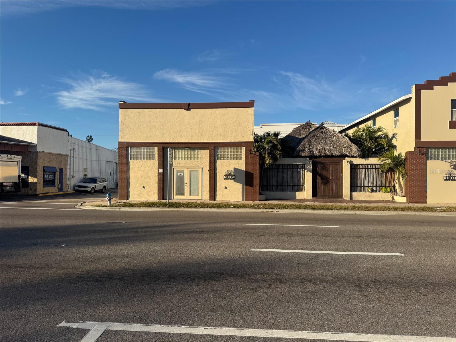 Prime commercial opportunity located at 1001 Manatee Avenue East in old downtown Bradenton, Florida. The property offers approximately 52 feet of frontage along Manatee Avenue East with excellent visibility and an AADT of approximately 22,500 vehicles per day. The site includes approximately 21 shared on-site parking spaces (with the property at 1007 Manatee Avenue) and is conveniently located minutes from Downtown Bradenton, US-41, and nearby residential neighborhoods. The property is zoned BR (Business/Residential) and T4-O (Transect 4 – Open) which support neighborhood-scale commercial, office, residential, and mixed-use development consistent with the City of Bradenton Comprehensive Plan. Uses and development standards are subject to City review and approval. Located in central Manatee County and near new multifamily development and just south of the Bradenton Riverwalk, this property presents a strong opportunity for owner-users or investors seeking a well-positioned commercial asset.  The property features an updated one-story building totaling approximately 2,100 square feet of open space.  The space is well suited for a boutique, studio, shared workspace, or a variety of commercial or event-related uses. The interior includes multiple private rooms and one restroom. Located east of the building is a covered tiki hut measuring approximately 30’ x 70’ (±2,100 square feet), providing a courtyard-style event area. The property has a proven history of use for weddings, meetings, and private celebrations, with seating capacity for approximately 80 guests.The property at 1007 Manatee Avenue East is also available for sale and includes a s 2 story office building.  Owner financing maybe available.  There is also a food truck that is available for $40,000.