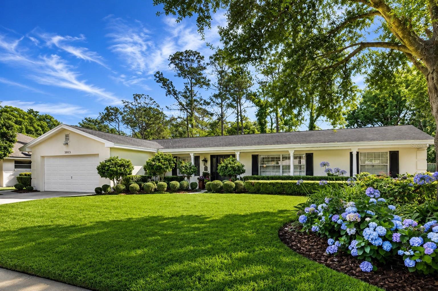 Imagine spending weekends by your private resort-style pool, entertaining effortlessly in expansive living spaces, and enjoying the convenience of being just minutes from Downtown Orlando—all without HOA restrictions or fees.

Welcome to this exceptional single-story residence in the sought-after Conway/SODO area, nestled within the charming, established neighborhood of Lake LaGrange Heights. Tucked away on quiet streets lined with mature trees and longtime residents, this beautifully maintained home offers 2,656 square feet of thoughtfully designed living space, where timeless design and meticulous craftsmanship are evident at every turn.

Lovingly cared for by the same owner for more than two decades, the home showcases an impressive blend of quality updates and enduring style. From the moment you arrive, professionally designed landscaping featuring mature flowering gardens, hydrangeas, camellias, agapanthus, knockout roses, and a majestic Cathedral Live Oak create unforgettable curb appeal.

Inside, an inviting foyer opens to elegant formal living and dining spaces, complemented by engineered hardwood flooring, crown molding, updated interior doors, and beautiful architectural details throughout. The desirable split-bedroom floor plan offers three spacious bedrooms, two-and-a-half bathrooms, and exceptional privacy for family and guests.

At the heart of the home is an expansive 47-foot by 16-foot great room designed for entertaining, while the adjacent gathering area with its wood-burning fireplace creates the perfect setting for cozy evenings or intimate dinners. The thoughtfully updated kitchen features abundant custom cabinetry with decorative glass accents, Corian countertops, pantry pull-out shelving, and generous workspace, all flowing seamlessly into the home’s inviting living areas.

French doors lead to a spectacular sun-filled family room overlooking a true backyard retreat. The resort-style pool, finished with elegant brick pavers and surrounded by lush tropical landscaping, creates a private oasis perfect for relaxing, entertaining, or enjoying Florida’s year-round outdoor lifestyle. A private irrigation well helps maintain the beautiful grounds with efficiency.

Beyond its beauty, this home offers tremendous peace of mind with numerous significant improvements, including a 30-year architectural roof, updated Trane HVAC system, renovated bathrooms, resurfaced pool with new tile, updated ductwork, RainSoft whole-house water treatment system, upgraded lighting, improved plumbing and sewer lining, drain field replacement, and countless thoughtful enhancements completed throughout the years.

Ideally positioned just minutes from the SODO Shopping District, Hourglass District, Milk District, Thornton Park, Lake Eola, Dr. Phillips Center for the Performing Arts, the Kia Center, Orlando Health, and Orlando International Airport, this home also provides quick access to I-4, SR 408, SR 417, the Beachline, Winter Park, and The Mall at Millenia.

With top-rated schools, sidewalks, an established neighborhood atmosphere, and the freedom of no HOA, this is a rare opportunity to own a meticulously maintained home where comfort, quality, and location come together beautifully.