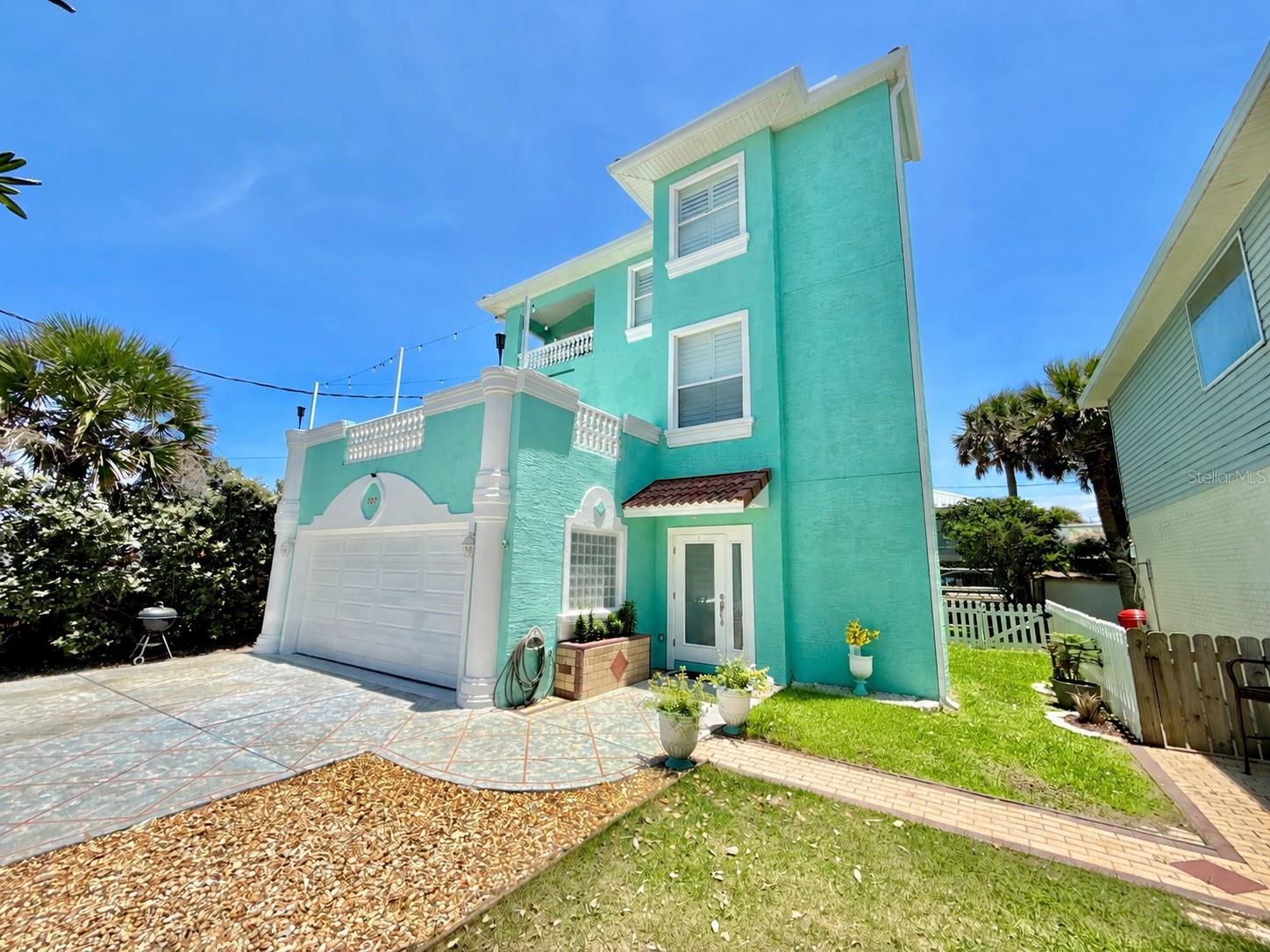 Welcome to beachside living in the heart of Flagler Beach. This spacious 3,000+ square foot, three-story home offers panoramic ocean views, an elevator, and a flexible layout designed for comfort, entertaining, and coastal relaxation.

The first floor features two bedrooms, a full bath, and its own inviting living area, creating a great space for guests, family, or extended stays. Upstairs, the second floor opens to a huge main living area with an office nook, an updated kitchen, tile and LVP flooring, and seamless access to an expansive deck where stunning ocean views set the perfect backdrop for entertaining or simply enjoying the sea breeze.

The third floor is dedicated to a large private primary suite filled with natural light and beautiful ocean views. Enjoy your own balcony, additional living area, and a spacious bath complete with a giant soaking tub and walk-in shower.

Just steps from the beach and some of Flagler Beach’s best restaurants, this home offers the ideal blend of space, views, convenience, and laid-back coastal charm.