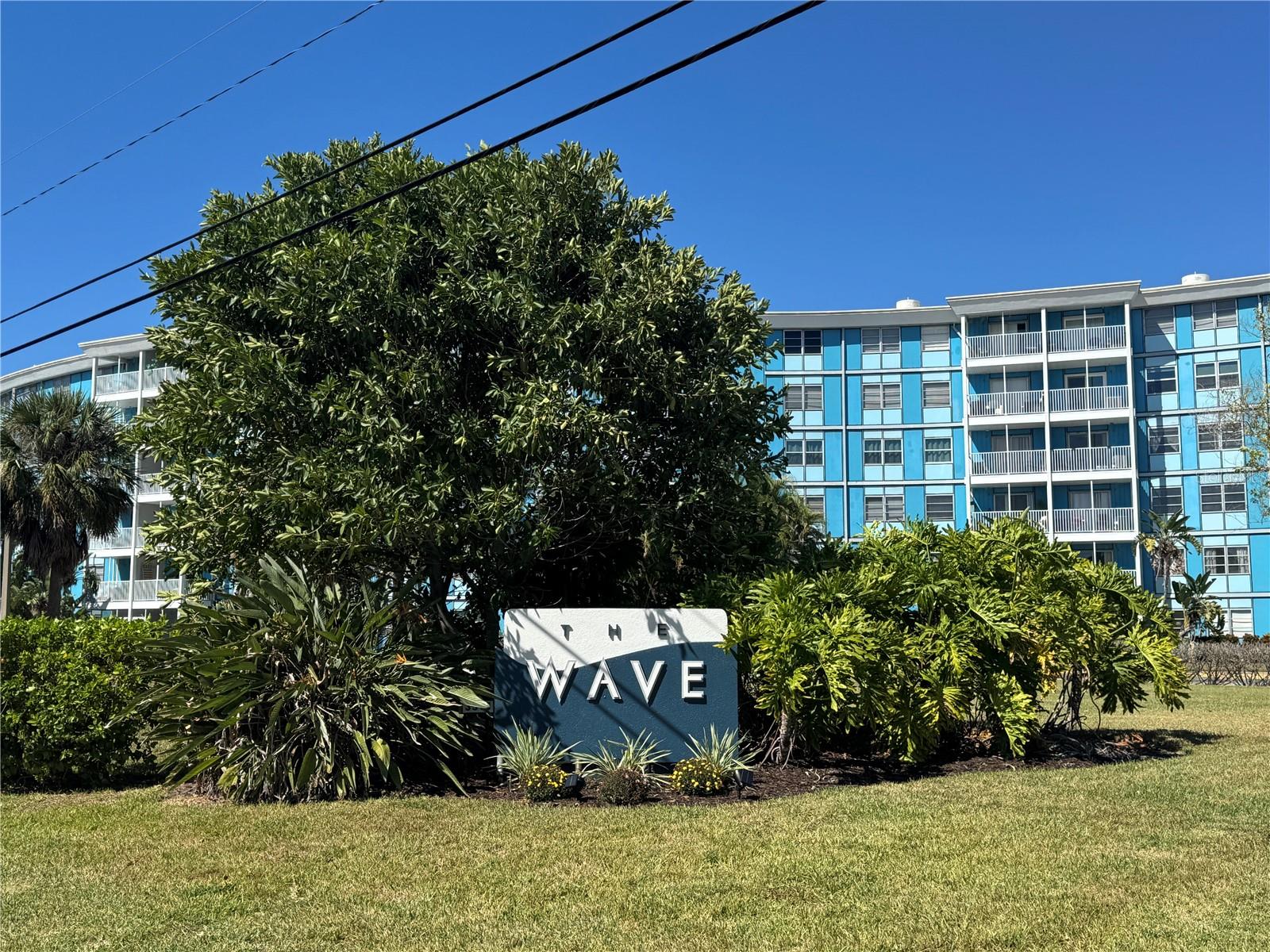 Furnished & Upgraded 2BR / 1.5BA Condo at The Wave! This condo is located in the desirable Wave community.
Spacious open-concept floor plan with vinyl flooring throughout living, dining, and kitchen areas. The kitchen features extra-large stainless steel appliances including a side-by-side refrigerator, dishwasher, range, and microwave. Enjoy pool and conservation views from the living area. Primary BR offers two closets, ample storage space, and a private ensuite bath. The Wave is a 6-story Brazilian Art Deco–style building full of charm and character. Community amenities include a fitness center, pool, BBQ area, secure FOB-only building access, and assigned parking conveniently located near the unit and staircase. Excellent location just minutes to I-275, St. Pete Beach, and Downtown St. Petersburg. Close to shopping, dining, banks, and all the activity of the growing Skyway District.