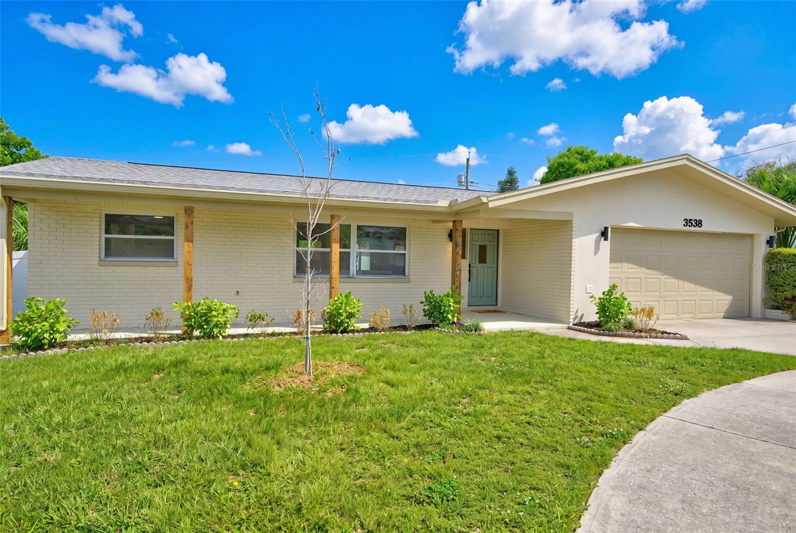 The Perfect Trifecta: Pool Home • Non-Flood Zone • Short-Term Rental Potential — Discover the perfect combination of lifestyle, location, and investment opportunity in this beautifully renovated 3-bedroom, 2-bath pool home offering 1,563 square feet of thoughtfully designed living space in Largo's desirable Harbor Hills neighborhood. Whether you're searching for a primary residence, vacation getaway, or income-producing investment, this home checks every box. Located in Flood Zone X (no flood insurance required) and offering the potential for short-term rentals, it presents an increasingly rare opportunity in today's market. Inside, the desirable split-bedroom floor plan offers privacy for the spacious primary suite, while two guest bedrooms are situated on the opposite side of the home and share a generously sized hallway bath. Three hallway closets provide an abundance of storage rarely found in homes of this size. The completely renovated interior is truly move-in ready, showcasing timeless finishes and a fresh coastal aesthetic throughout. The beautifully appointed kitchen features crisp white cabinetry accented by soothing blue tones, custom quartz countertops, a striking blue tile backsplash, abundant cabinetry, and a full pantry wall surrounding the refrigerator for exceptional storage and functionality. Oversized Scandinavian-inspired luxury vinyl plank flooring flows seamlessly throughout the home, adding warmth, durability, and contemporary style. The open-concept living and dining areas transition effortlessly into the rear family room, where sliding glass doors lead to your own private backyard retreat. Designed for easy Florida living, the outdoor space features a sparkling pool surrounded by low-maintenance turf, an expansive deck for lounging and entertaining, and a dedicated fire pit gathering area — perfect for relaxing evenings under the stars or hosting family and friends. Additional highlights include an attached two-car garage,  2018 roof, 2025 HVAC system, and fully paid-off solar panels, providing energy efficiency and helping keep utility costs low for years to come. Ideally located in the sought-after Harbor Hills neighborhood, you'll enjoy quick access to award-winning Gulf beaches, beautiful parks, shopping, dining, and everyday conveniences. Tampa International Airport is less than 30 minutes away, while St. Pete–Clearwater International Airport is approximately 20 minutes from your doorstep. Beautifully updated, ideally located, and packed with sought-after features — including a pool, no flood insurance requirement, and short-term rental potential — this home truly is the perfect trifecta.