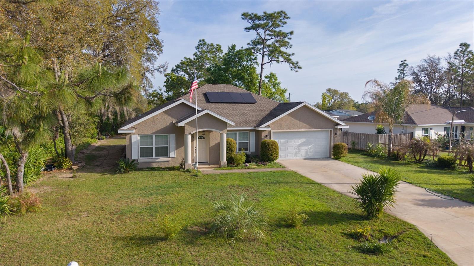 . 
This home is all-electric and includes solar (the system may be purchased by the buyer, or the seller can remove it). The average electric bill is approximately $30/month with solar.. The property is serviced by well water and septic... Welcome to your private oasis with no bond or HOA. Located in Silver Springs Shores. Home is better than new built in 2022 with ASSUMBABLE LOAN. Seller has done a wonderful job with land scaping, so you won't have to. Home sits almost a quarter acre with 1934 sq ft. 
Soft close cabinet doors with large pull-out drawers. Bronze fixtures thru out kitchen and baths. Large Master bedroom with trey ceiling and archway to an ensuite bath that has roman shower. Dining room is highlighted with a trey ceiling and recessed lighting. Inside laundry. The spacious primary bedroom showcases a tray ceiling and an arched entry to the en-suite bath, which includes a Roman-style walk-in shower. The dining room also stands out with a tray ceiling and recessed lighting, and graceful archways connect the hallway to both the family room and dining room for an open, inviting feel
 Lots of cabinets in kitchen to hold your pots and pans with sit up bar. Archways lead from the hall to Family room and Dining room. Home is on well water and septic .