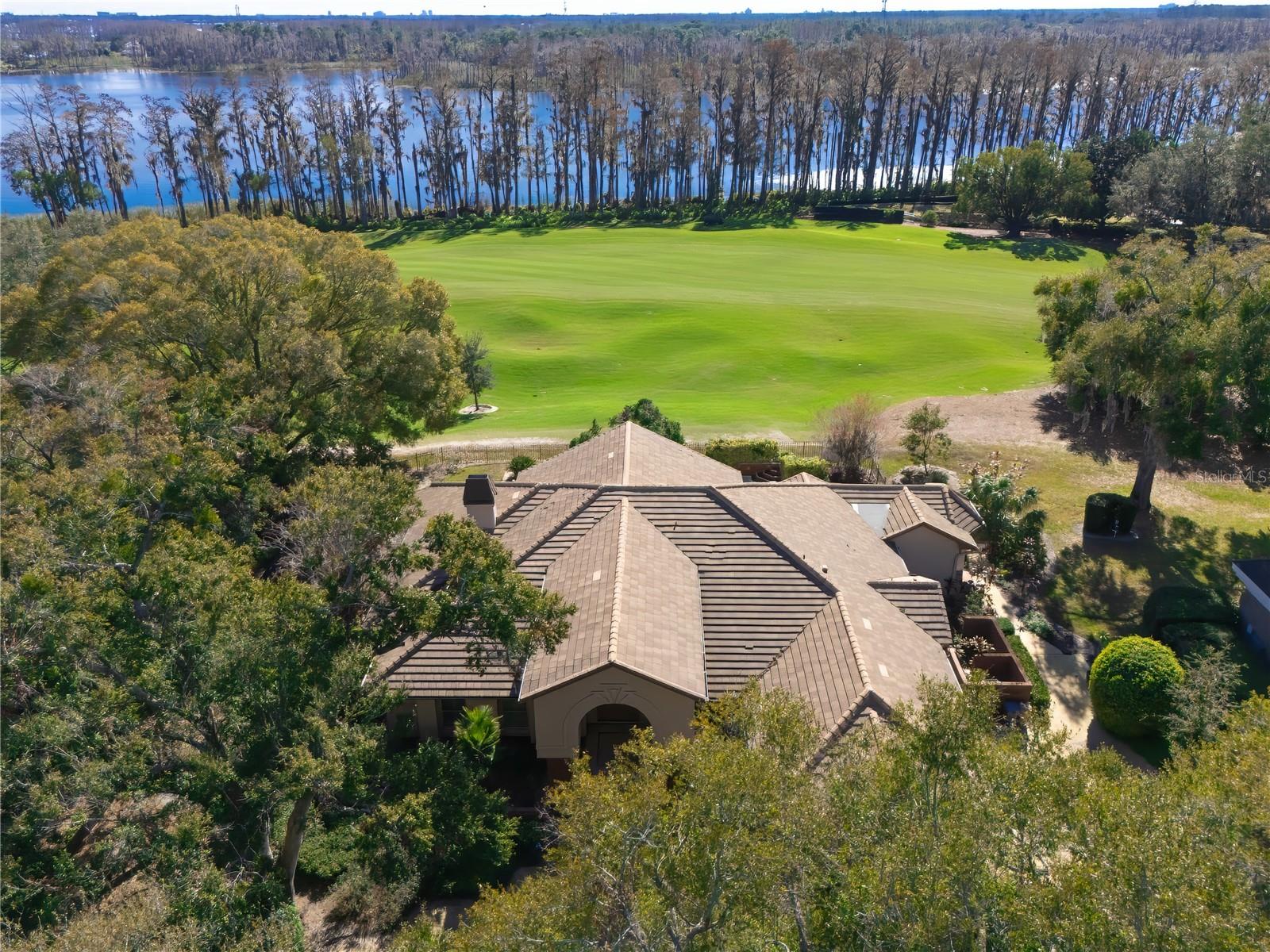 Welcome to luxury living at its finest! Nestled within the exclusive and world-renowned Isleworth Golf and Country Club community, this remarkable residence on over half an acre offers 4-bedrooms, 3.5 bathrooms and spans an impressive 3,872 square feet, providing ample space for comfortable living and entertaining. The open living space features high ceilings, large windows, and an abundance of natural light, creating an inviting and airy atmosphere with picturesque and panoramic views across the 17th fairway, serene Lake Louise and the wildlife sanctuary. As you approach, the meticulously manicured landscaping welcomes you to the 24-hour manned gated entrance, ensuring privacy and security. Beyond the confines of your luxurious community, you'll find yourself just a short drive away from Orlando's most renowned attractions, including Disney, Universal Studios, Restaurant Row and the finest golf courses and shopping destinations in the area. Welcome to your new home in Isleworth where elegance meets convenience and where luxury knows no bounds.