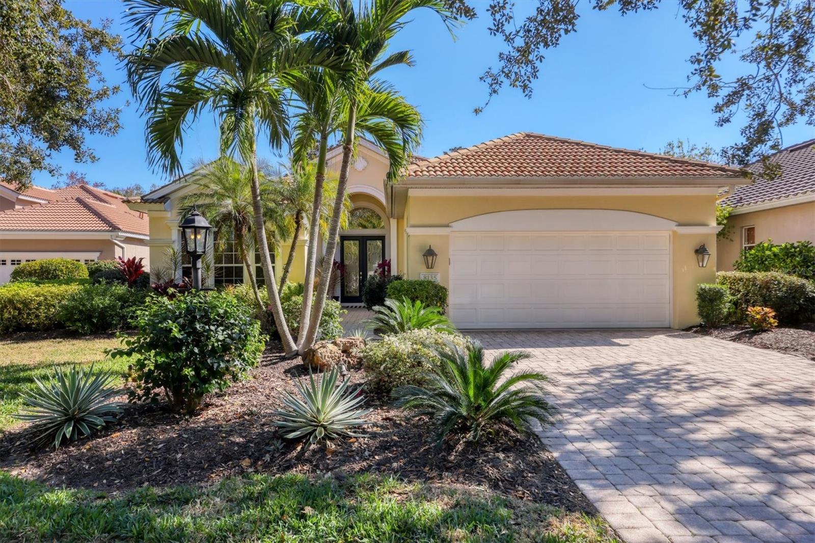 Located in the award-winning University Park Country Club, this beautifully maintained 3-bedroom, 2.5-bath home with an office/den and private pool is nestled in the maintenance-free Kenwood Park neighborhood, which also offers its own community pool.

A pavered driveway and walkway guide you through lush tropical landscaping to double leaded glass entry doors accented by an arched transom window. Enjoy exceptional privacy with wooded preserve views both in front of and behind the home—no neighboring homes across the street.

The bright foyer opens to a combined living and dining room featuring diagonal tile flooring, architectural details, and an open, inviting layout. The living room flows seamlessly into the kitchen and is enhanced by crown molding, recessed lighting, a modern ceiling fan, built-in cabinetry and shelving, and a fully retractable triple sliding glass door leading to the lanai—perfect for indoor-outdoor living.

The light and airy eat-in kitchen offers light cabinetry, a raised breakfast bar, a dedicated coffee bar area, aquarium window overlooking the lanai, and charming window seating.

The spacious primary suite features carpeted flooring, two walk-in closets, abundant windows, a cozy seating area, tray ceiling, ceiling fan, and recessed lighting. The fully renovated, spa-like primary bath boasts a large zero-entry walk-in shower with bench, a freestanding soaking tub, and dual vanities. Two guest bedrooms offer plush carpet, ceiling fans, and large windows. The office/den—currently used as a fourth bedroom—features crown molding, a ceiling fan, recessed lighting, and double-door entry. The guest bathroom includes a tub/shower combination with a new vanity and countertop, while a convenient half bath is located on the lanai.

Outdoor living shines on the private lanai with epoxy-finished flooring, a heated resurfaced pool with in-floor cleaning system, and a modern ceiling fan. A large decorative mural enhances privacy while complementing the tranquil tropical and wooded backdrop.

Additional features include a well-appointed laundry room with sink, cabinetry, and two closets, as well as an oversized two-car garage with extensive storage cabinetry and countertops.

This home offers the perfect blend of privacy, comfort, and resort-style living in one of University Park Country Club’s most desirable neighborhoods.  Furniture available separately.

University Park Country Club is consistently ranked one of the top courses in Florida featuring 27 holes of championship golf; tennis and pickleball; fitness center, croquet – as well as an array of social and group activities.  Just a 15-minute drive outside this peaceful enclave is downtown Sarasota, with shopping, arts & theatres, museums, dining and entertainment, top-ranked healthcare, beaches and SRQ International Airport.  Two miles east of UPCC is the convenience of I-75, University Town Center with over 300 nationally known and
homegrown shops, restaurants, fitness studios, services and attractions, the Nate Benderson Park, home of world-class rowing events and the Mote Marine Aquarium.

Enjoy the club amenities with the required minimum of a Social membership at UPCC, which is owned by the residents through a Recreation District.