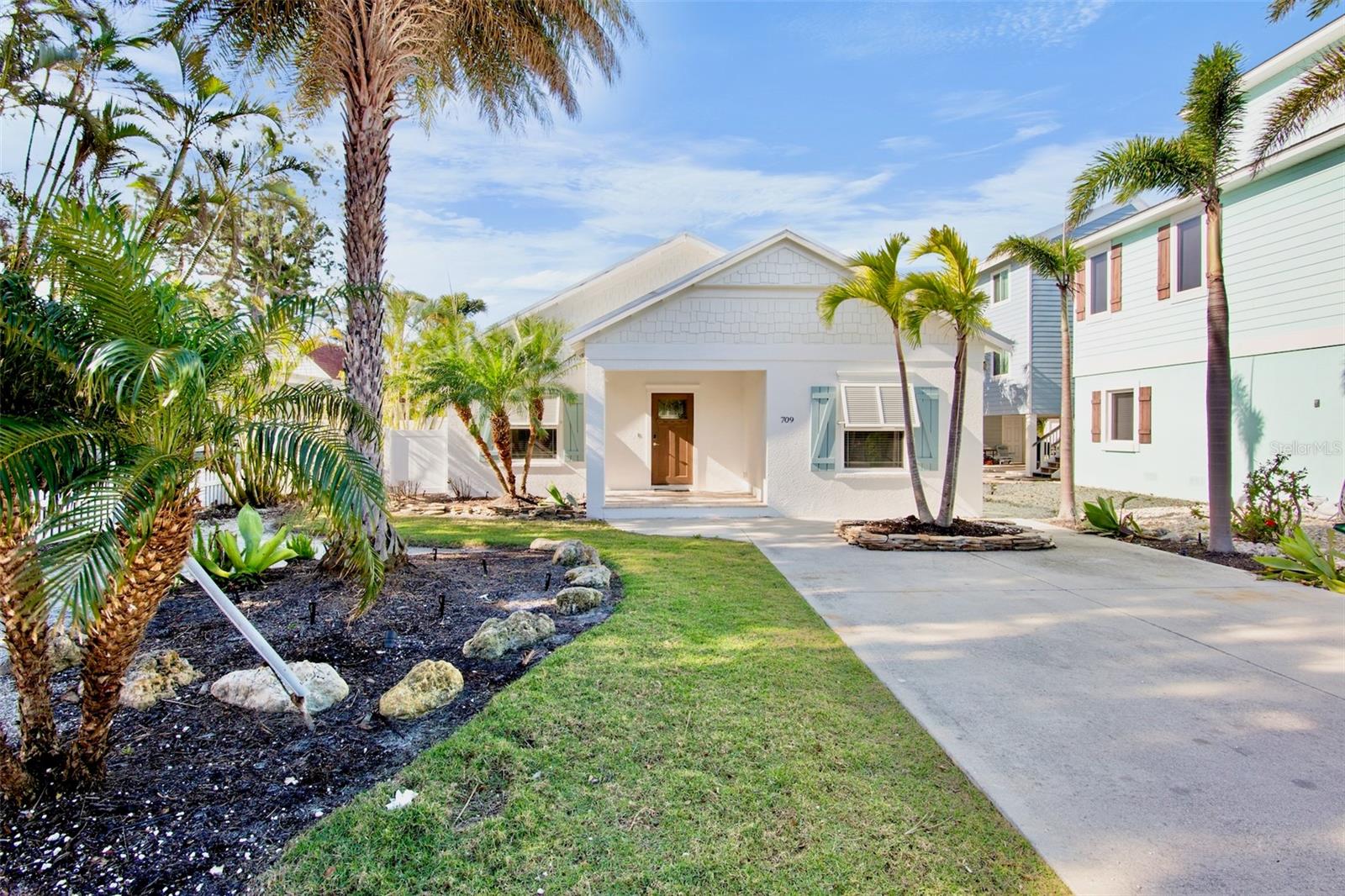 Welcome to "Birdsong"! Discover the perfect blend of island charm and modern comfort in this beautifully updated 2-bedroom, 2-bath home located in one of Anna Maria Island’s most desirable neighborhoods. Just a 3-minute walk to the pristine Gulf beaches, this property offers the ideal setting for full-time living, a second home, or a high-performing investment. Step inside to an inviting open-concept layout featuring bright coastal décor, tile flooring throughout, and a seamless flow from the living area to the well-appointed kitchen with stainless steel appliances, granite countertops, and ample storage. Retreat to the serene primary suite with its private bath, while guests enjoy a comfortable second bedroom and full bathroom. Outdoors, your private oasis awaits—complete with a sparkling saltwater pool, lush tropical landscaping, and multiple lounging areas perfect for relaxing after a day at the beach. With established successful vacation rental performance, this home comes turnkey-ready for immediate enjoyment or continued income generation.
