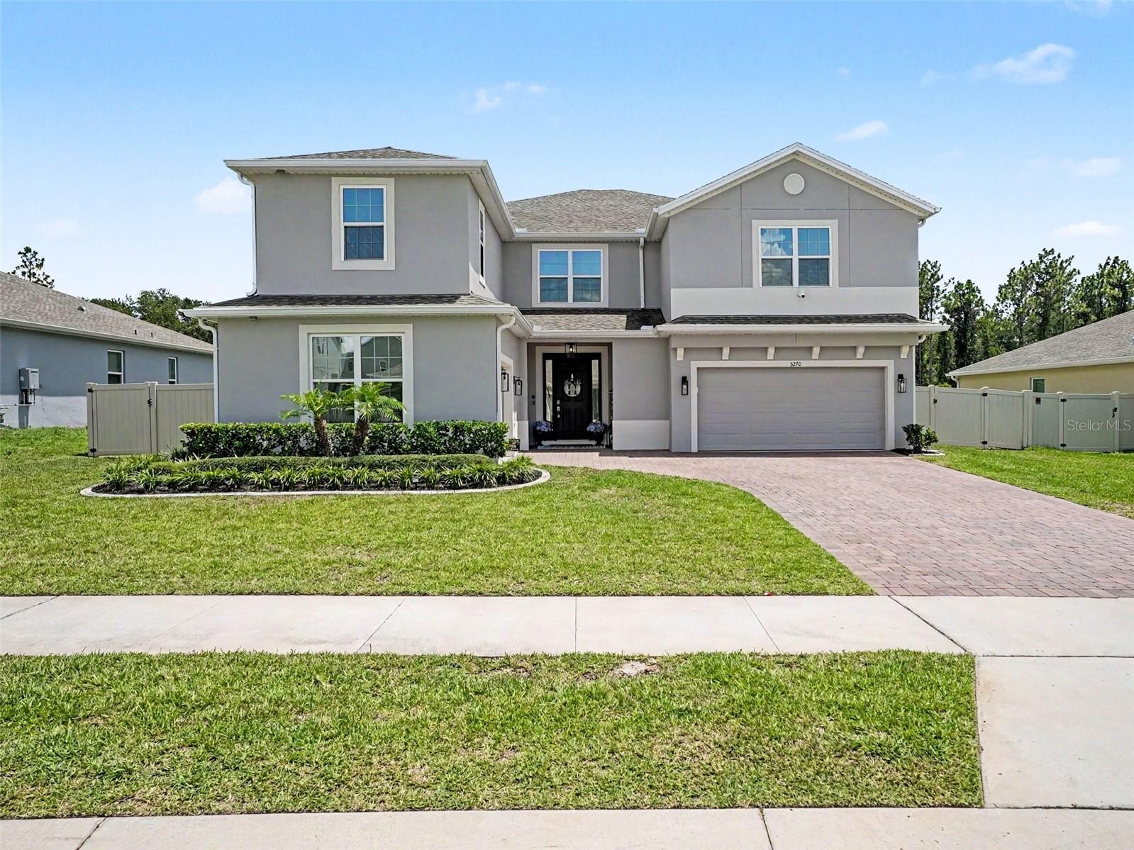 Experience refined living in this exceptional 2022-built Palmer floor plan located in the sought-after Bargrove Estates community of Mount Dora. Situated on a premium homesite with no rear neighbors, this meticulously upgraded residence offers 4,583 square feet of luxurious living space with 6 bedrooms, 4.5 bathrooms, a dedicated office/flex room, spacious upstairs loft, and a 3-car garage.

Designed with both elegance and functionality in mind, the open-concept floor plan features soaring 9'4" ceilings on the main level, luxury vinyl plank flooring downstairs, plush carpeting upstairs, custom decorative accent walls, designer Kichler lighting, UV-tinted windows throughout, and custom closet systems by Closets By Design. The gourmet kitchen is beautifully appointed with quartz countertops, abundant cabinetry, a large center island, natural gas cooking, and an effortless flow into the expansive living and dining areas, perfect for everyday living and entertaining.

The second floor is accessible via two distinct stairwells, enhancing both convenience and privacy throughout the home. Upstairs also features a spacious loft and additional living flexibility.

The luxurious primary suite offers a true retreat with dual walk-in closets, separate vanities, a soaking tub, and an oversized walk-in shower with touch controls. Upstairs, the loft is enhanced by a custom wet bar featuring a stunning quartzite countertop, creating the ideal space for movie nights, entertaining, or relaxing with family and friends.

Step outside to your own private backyard oasis. With over $120,000 invested in professional landscaping and outdoor enhancements, this space was designed to impress. Enjoy a heated resort-style pool with automatic cleaning and drain systems, removable child safety fence, extended paver patio, and a fire pit gathering area. The covered lanai is enclosed with a motorized screen, features motorized sliding door blinds, and is pre-plumbed for a future summer kitchen. The fully fenced backyard includes three access gates and offers exceptional privacy.

Additional premium upgrades include a whole-house water softener, dual-zone HVAC with two air conditioning systems, tankless natural gas water heater, CAT 6 wiring, SafeTouch security system, Ring video doorbell, touch keypad entry, six-camera surveillance system, gutters, dedicated holiday lighting outlets, and numerous smart-home features throughout.

Ideally located just minutes from the charm of historic downtown Mount Dora, residents enjoy boutique shopping, waterfront dining, parks, festivals, and convenient access to SR-429, making Orlando, Lake Mary, and surrounding areas easily accessible.

Luxury, privacy, and thoughtful upgrades come together in this truly move-in-ready home. Every detail has been carefully curated, creating a one-of-a-kind opportunity that is far beyond builder grade.