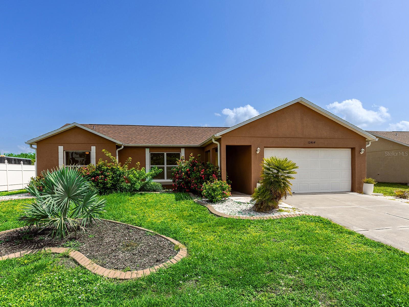 Enjoy the best of Florida living in this three-bedroom, two-bath home ideally situated less than 20 minutes from the sandy shores of Englewood Beach. Whether you're searching for a year-round residence, seasonal retreat or investment opportunity, this home offers a functional layout, major system updates and plenty of potential to make it your own. The split-bedroom floor plan provides privacy for the primary suite, complete with a walk-in closet, while the inviting living spaces offer flexibility for both everyday living and entertaining. The kitchen features ample counter space, a convenient closet pantry and easy access to the screened lanai, creating a comfortable flow for indoor and outdoor living. Recent improvements provide added confidence, including a new water heater in June of 2026, a new air conditioner in 2024 and a new roof in 2023. Outside, the chain-link fenced backyard offers a secure space for pets, play or gardening, while the desirable X flood zone adds additional peace of mind. Conveniently located near shopping, dining, golf courses, parks and some of Southwest Florida's most beautiful Gulf beaches, this home combines everyday convenience with the relaxed coastal lifestyle that makes Florida such a desirable place to call home.