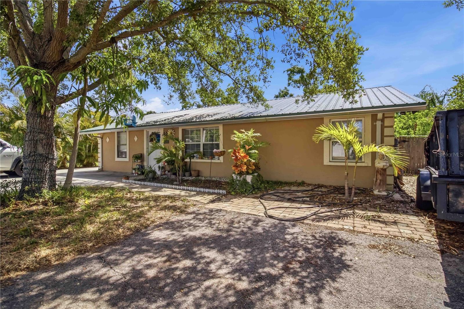 This 3 bedroom, 1 -1/2,bathroom home offers a split floor plan and an open living room and kitchen area that feels spacious and functional. The home has been maintained over the years and includes a permitted outdoor porch added in 2021, perfect for enjoying the large backyard and outdoor space.The metal roof was installed in 2018, giving buyers peace of mind on one of the major updates already completed. The yard offers plenty of room for pets, gatherings, parking, or future projects.Priced at $300,000, this is a solid option for buyers looking for space and value. Sellers are motivated.