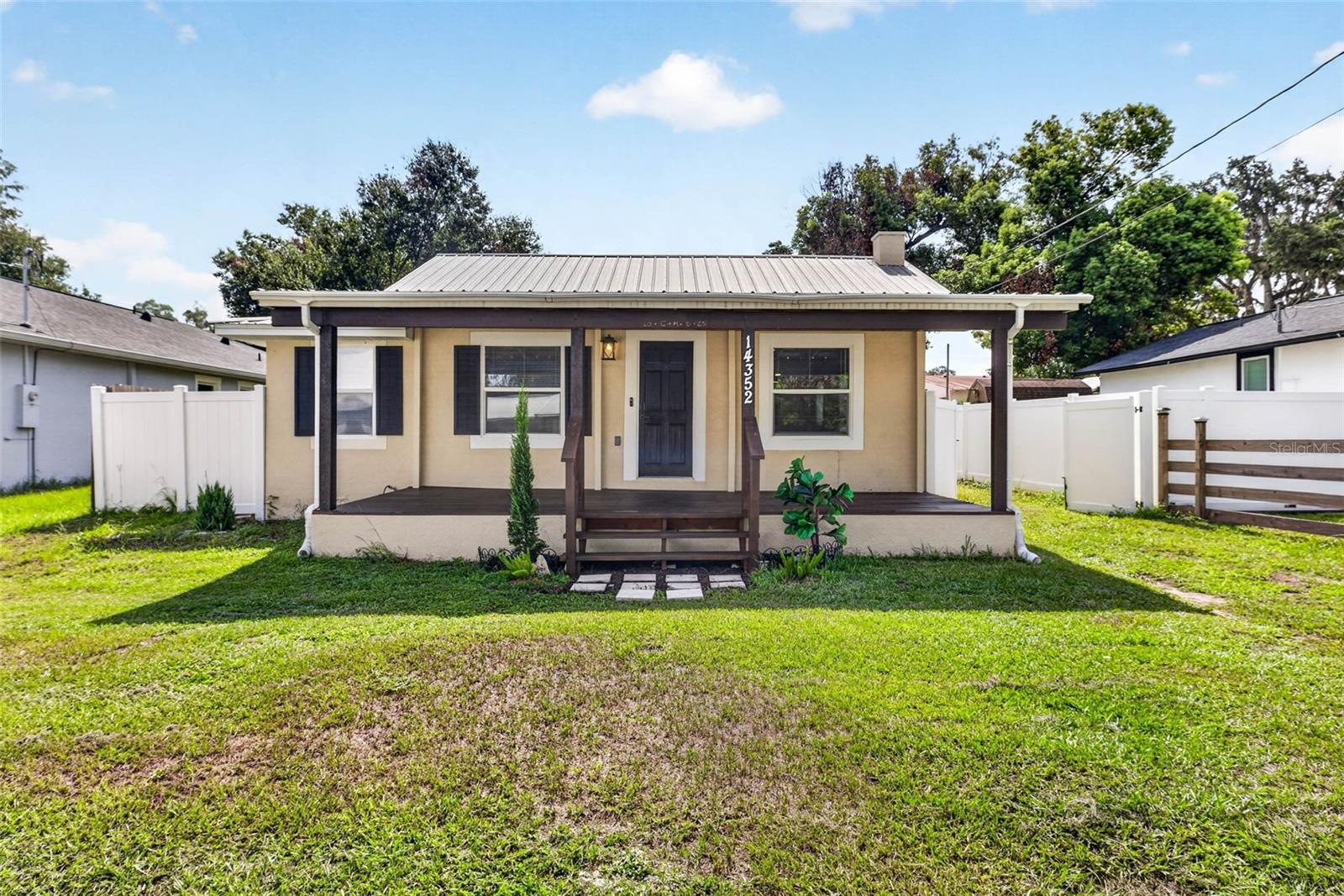 Welcome to this beautifully remodeled 2-bedroom, 1.5-bath home in Dade City, where modern updates and timeless charm come together. This move-in-ready property features a thoughtfully renovated interior, a newer metal roof, new siding, and a welcoming new front porch that enhances both curb appeal and outdoor enjoyment. Nestled on a quiet dead-end street, the home also offers a fully fenced backyard, providing the perfect space for pets, play, gardening, or relaxing outdoors. Adding exceptional value and versatility is also a DETACHED STUDIO, complete with its own FULL BATHROOM, KITCHENETTE, and laundry hookup—ideal for guests, a private home office, creative space, or potential rental income. Conveniently located near downtown Dade City's shops, restaurants, and local attractions, this unique property offers comfort, flexibility, and endless possibilities. Don't miss your opportunity to make this exceptional home your own!