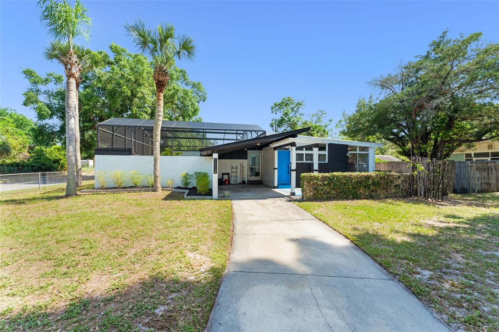 **This house comes with a REDUCED RATE through the seller's preferred lender. This is a lender-paid rate buydown that reduces the buyer's interest rate and monthly payment.**

Welcome to 7712 Hoosier Place in Orlando, a single-story home with a flexible floorplan, multiple living areas, a studio in-law suite, and a spacious screened pool area. The layout offers a practical setup for everyday living, entertaining, and added privacy, with several rooms that can adapt to different needs.

Inside, the main living area includes an open and functional gathering space that connects easily for day-to-day use. A flex room adds extra versatility and can serve as a home office, playroom, hobby space, study area, or additional sitting room. The home also includes a laundry room and well-placed bathroom access for convenience.

One of the standout features is the large studio in-law suite, offering a private bedroom-style living space with its own kitchenette and bathroom nearby. This setup works well for extended family, long-term guests, multigenerational living, or a private retreat within the home. Additional bedrooms are positioned on the opposite side of the layout, creating useful separation and privacy.

Outdoor living is a major highlight, with a large screened pool area at the center of the floorplan. This space creates a private setting for relaxing, entertaining, and enjoying Florida weather while staying protected from the elements. The screened enclosure offers room for poolside seating, dining, and weekend gatherings.

Located in Orlando, the home offers convenient access to shopping, dining, schools, parks, major roadways, and everyday services. The area provides a residential setting while keeping buyers close to Central Florida amenities, employment centers, and recreation.