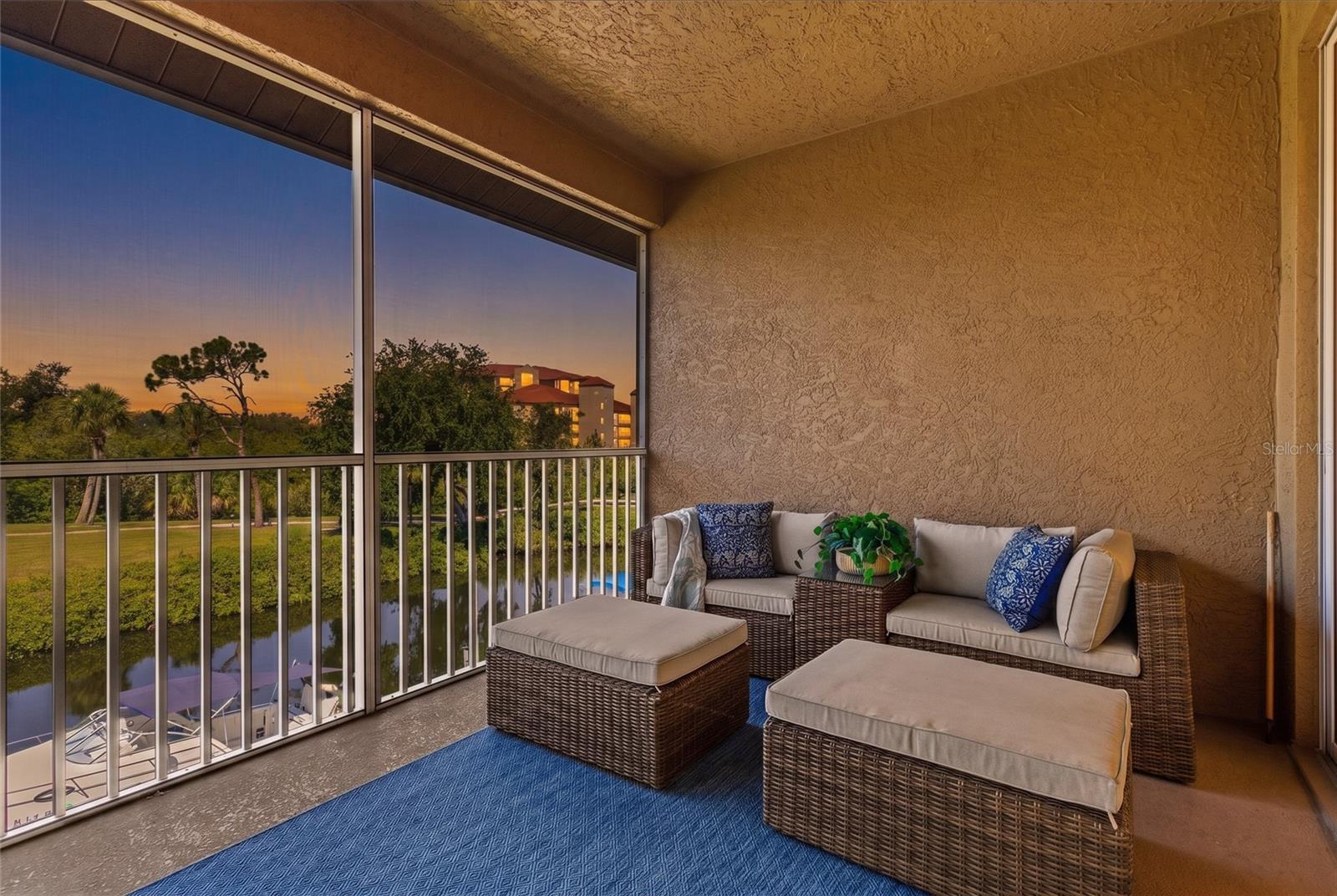 West-Facing Canal Views in Gated Blackburn Harbor. This second-floor, 3-bedroom, 2.5-bath condo in Blackburn Harbor Waterfront Villas puts you directly on the canal with west-facing views that make sunsets a daily event worth watching. At 2,006 square feet, the layout is spacious and light-filled — vaulted ceilings in the living, dining, primary suite and kitchen areas, two sets of sliding glass doors opening to a screened lanai over the water, and side windows that keep natural light moving through the unit all day. Canal views extend from the main living and dining areas into the primary suite, giving the heart of the home a constant connection to the water. The primary suite features a private slider to the lanai, dual closets, and an ensuite bath with dual sinks, a jetted garden tub, and a walk-in shower. The second bedroom is a spacious ensuite with a walk-in closet. The third bedroom, with its French doors, works equally well as a guest room, home office, or flex space. The kitchen and ensuite baths feature solid wood cabinetry and granite countertops. Updated stainless steel appliances complete the kitchen. Major systems: A/C (2016), water heater (2021). Blackburn Harbor is a gated, 11-acre waterfront community with a heated pool, tennis and pickleball courts, BBQ gazebo, kayak storage and launch, and a boat dock rental program (subject to availability), with easy access to the Intracoastal Waterway and the Gulf of Mexico just beyond. No trailering, no storage hassles — just head out on the water and return to the convenience of your own dock. HOA: $980/month. Pets welcome up to 40 lbs. Monthly rentals permitted (1-month minimum), making this a strong option for investors or seasonal owners. Minutes from Nokomis Beach, The Legacy Trail, Downtown Venice, Oscar Scherer State Park, Sarasota Memorial Hospital Venice Campus, nationally acclaimed Pine View School, and the dining and shopping along US-41 — centrally located between Sarasota and Venice. Minutes away from I-75 and the 681 connector.  A rare opportunity to live, entertain, and boat from the same address.
Schedule your private showing today.