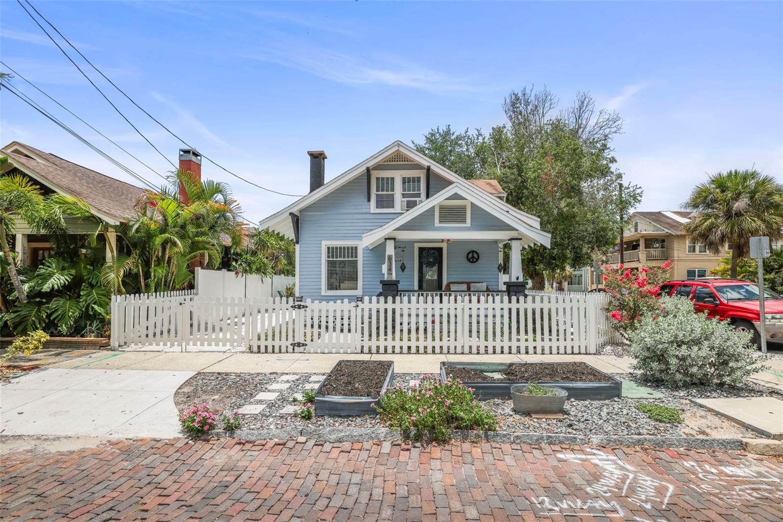 Welcome home to this beautifully updated and furnished 1925 Craftsman bungalow in the heart of Historic Uptown St. Petersburg! This charming 2-bedroom, 2-full-bath home perfectly blends historic character with modern upgrades. 

From the moment you arrive, you’ll appreciate the new driveway, inviting front porch, and classic white picket fence that showcase the home’s timeless curb appeal. Inside, you’ll find a bright and welcoming interior featuring fresh paint throughout & new flooring. 
The heart of the home is the newly updated kitchen, thoughtfully designed to maintain the character of the original built-ins while incorporating modern finishes and functionality. The first floor offers a spacious living area filled with natural light, a bedroom, full bathroom, laundry/mudroom with front-loading washer and dryer, and additional storage space.

Upstairs, the oversized loft-style primary suite provides incredible flexibility for a reading nook, home office, gym, or yoga space. The bathroom has been refreshed with a new vanity, adding style and convenience to this unique retreat.

Step outside to enjoy the fully fenced yard and brick-paved entertaining area, perfect for relaxing or hosting family and friends.

LOCATION, LOCATION, LOCATION! Leave the car at home and enjoy one of St. Petersburg’s most walkable neighborhoods. Just two blocks from Round Lake Park and minutes from Crescent Lake, you’ll be surrounded by local favorites including coffee shops, restaurants, wine bars, yoga studios, parks, pickleball and tennis courts. Downtown St. Pete, Beach Drive, The Pier, The Vinoy, museums, hospitals, Tropicana Field, and the waterfront are all just a short walk or bike ride away.

This rare Historic Uptown gem combines vintage character, thoughtful updates, and an unbeatable location—making it the perfect place to call home.
