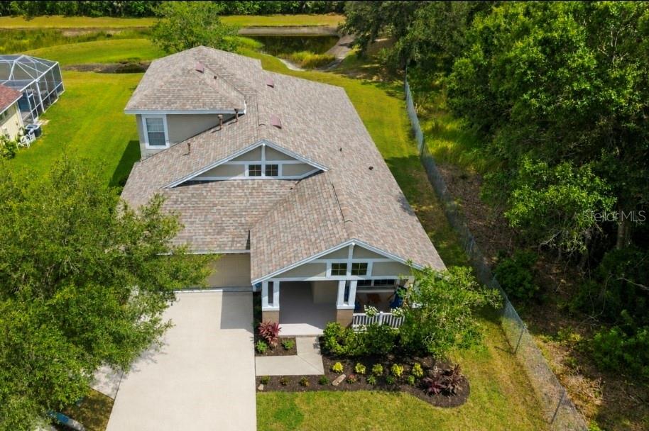 Virtually Staged. Welcome to 5154 Pheasant Woods Dr. offering 4 bedrooms/3 full bathrooms/bonus room in Lutz, FL, situated on an oversized ¼ ACRE homesite on a quiet CUL-DE-SAC with only one neighboring home, providing added privacy and a peaceful setting. Located in an A rated school district with NO CDD and a low HOA, this home also offers access to the community pool.. 
Step inside to discover recently installed light and airy LUXURY VINYL flooring throughout the 1st floor that enhances the bright, open feel. The spacious living room is highlighted by triple sliding glass doors that fill the space with natural light and lead to the covered lanai overlooking a tranquil retention pond, the perfect place to enjoy your morning coffee, unwind after a long day, or entertain family and friends.
The upstairs bonus room includes a fourth bedroom and full bathroom, offering flexible space for guests, multigenerational living, a home office, media room, game room, or private retreat. Enjoy peace of mind with a 2020 ROOF, 2022 WATER HEATER and 2023 A/C. Conveniently located just minutes from St. Joseph's Hospital North, Tampa International Airport, shopping, dining, top rated schools, and major roadways, this home combines thoughtful updates, a functional floor plan, and an unbeatable location. Don't miss your opportunity to make it yours!!