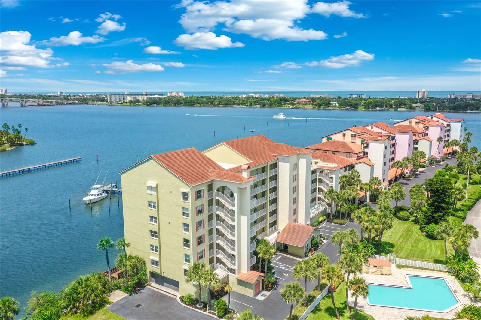 CALLING ALL BOAT LOVERS! YOU CAN DOCK YOUR BOAT AT YOUR BACK DOOR FOR ONLY $500/YR! LAUNCH YOUR BOAT IN SECONDS! THE BOAT DOCK AT YOUR HOME SIGNALS A LIFESTYLE OF LEISURE AND AQUATIC ADVENTURES, WHICH ADDS TO THE ASPIRATIONAL ALLURE! THE MAGNETIC CHARM OF LIVING ON THE RIVERFRONT CAN BE YOURS! THE INTERIOR OF THIS CONDOMINIUM HOME WAS DESIGNED TO FEEL SERENE, WELCOMING, AND RESTORATIVE. WHEN GUESTS ENTER THE LIVING ROOM, THEIR ATTENTION IS IMMEDIATELY DRAWN TO THE DRAMATIC WATERFRONT VIEWS. THE RIVERFRONT BALCONY ANCHORS THE ROOM, INSTEAD OF ALLOWING EVERYTHING TO BLEND TOGETHER. THE SHOW KITCHEN IS ACCENTED WITH TILE THAT BLENDS TOGETHER SEAMLESSLY INTO THE GRANITE AND ADDS TEXTURE, WHILE CREATING A 3 DIMENSIONAL EFFECT. ALL THE APPLIANCES INCLUDING THE A/C ARE UNDER WARRANTY. THE CURVACEAOUS BREAKFAST BAR IS MULTIFUNCTIONAL AND ECHOES THE NATURAL FLOW. THE DINING ROOM CREATES A SPACE WITHIN A SPACE. IT'S DISTINCT, YET STILL CONNECTED TO THE LIVING ROOM. THE WATERFRONT PRIMARY SUITE

BALANCES SOPHISTICATION WITH COMFORT, CREATING A DEEPLY PERSONAL SPACE WITH HOLLYWOOOD CLOSETS AND AN ELEGANT SPA-STYLE BATH. THE GUEST SUITE, BATH, AND INDOOR LAUNDRY COMPLETE THIS OPEN FLOOR PLAN.
THIS CONDOMINIUM FEATURES QUALITY AT EVERY TURN AND CINEMATIC VIEWS 24 HOURS A DAY.
THERE ARE NO SPECIAL ASSESSMENTS AND THE SIRS AND MILESTONE REPORTS ARE SUCCESSFULLY EXECUTED.
A SHORT WALK TO THE DOWNTOWN DAYTONA SHOPPING DISTRICT, JACKIE ROBINSON BASEBALL FIELD, FARMER'S MARKET, AND RIVERFRONT ESPLANADE ON BEACH STREET.
THE MOST WALKABLE CONDO TO THE BOUTIQUE SHOPS, LIVELY LITTLE CAFES, AND ART GALLERIES.