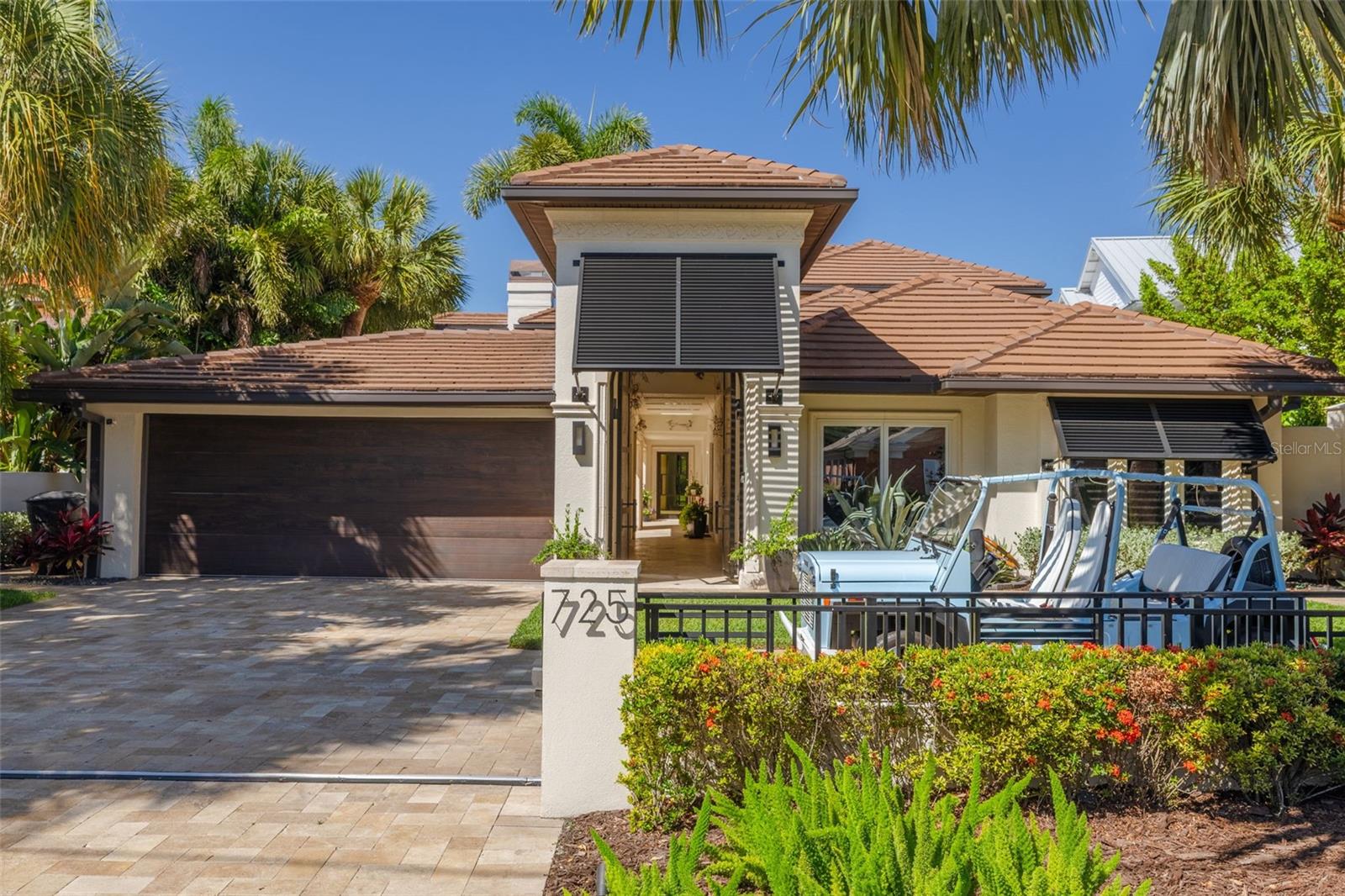 Under contract-accepting backup offers. A rare expression of modern luxury and timeless coastal elegance, this extraordinary waterfront estate is nestled in the highly sought-after enclave of Snell Isle in Northeast St. Petersburg. Perfectly positioned on Tampa Bay with unobstructed water access and no bridge restrictions, this property offers an unparalleled boating lifestyle with seamless access to the open waters of Tampa Bay & the Gulf of America.  Completely renovated, reimagined, and restored in over the last 5 years, the residence lives like a true work of art — where every finish, texture, and architectural detail has been intentionally curated. Fully protected with impact windows and doors, the home welcomes you through dramatic arched steel double entry doors into a world of refined sophistication and resort-style living.  Expansive EuroWall folding doors dissolve the boundary between interior and exterior spaces, creating a breathtaking indoor-outdoor experience flooded with natural light and panoramic water views. At the heart of the outdoor living area, a stunning double-sided gas fireplace connects seamlessly to the outdoor grille and entertaining space, all sheltered beneath a remote-controlled pergola for year-round enjoyment.  The gated entry opens to an impressive motor court with an additional parking pad, while lush mature landscaping and concrete block privacy walls create a serene and secluded setting. A tranquil copper fountain in the entry courtyard provides a zen-inspired retreat and is complemented by a nearby spa-like Japanese bath featuring a soaking tub for ultimate relaxation.Designed for both elevated entertaining and effortless everyday living, the home features a sprawling media room complete with a 110-inch projection screen and movie bar, a custom temperature-controlled wine cellar, and a striking bespoke bar with with Agate countertops & Cristallo backlit stone accents. The brand-new designer kitchen showcases custom cabinetry, stunning Titanium Gold granite countertops, and a premium appliance package featuring Monogram and Wolf appliances.The luxurious primary suite offers a true private sanctuary with a spa-inspired bathroom featuring a custom walk-in shower enclosed with steel door, an oversized soaking tub, and an adjacent dedicated workout room. Outdoors, the gorgeous resort-style pool and spa embody the quintessential Florida lifestyle with dramatic water features, fountains, and a slide perfect for entertaining family and guests alike. Along the waterfront, a new concrete seawall with metal fencing leads to an expansive composite dock equipped with multiple boat lifts, including a 10,000-pound lift and a 20,000-pound rated G6 super-fast lift — a dream setup for the avid boating enthusiast.There are simply too many remarkable features and custom details to list. This one-of-a-kind waterfront masterpiece must be experienced in person to truly appreciate its extraordinary craftsmanship, design, and lifestyle.
