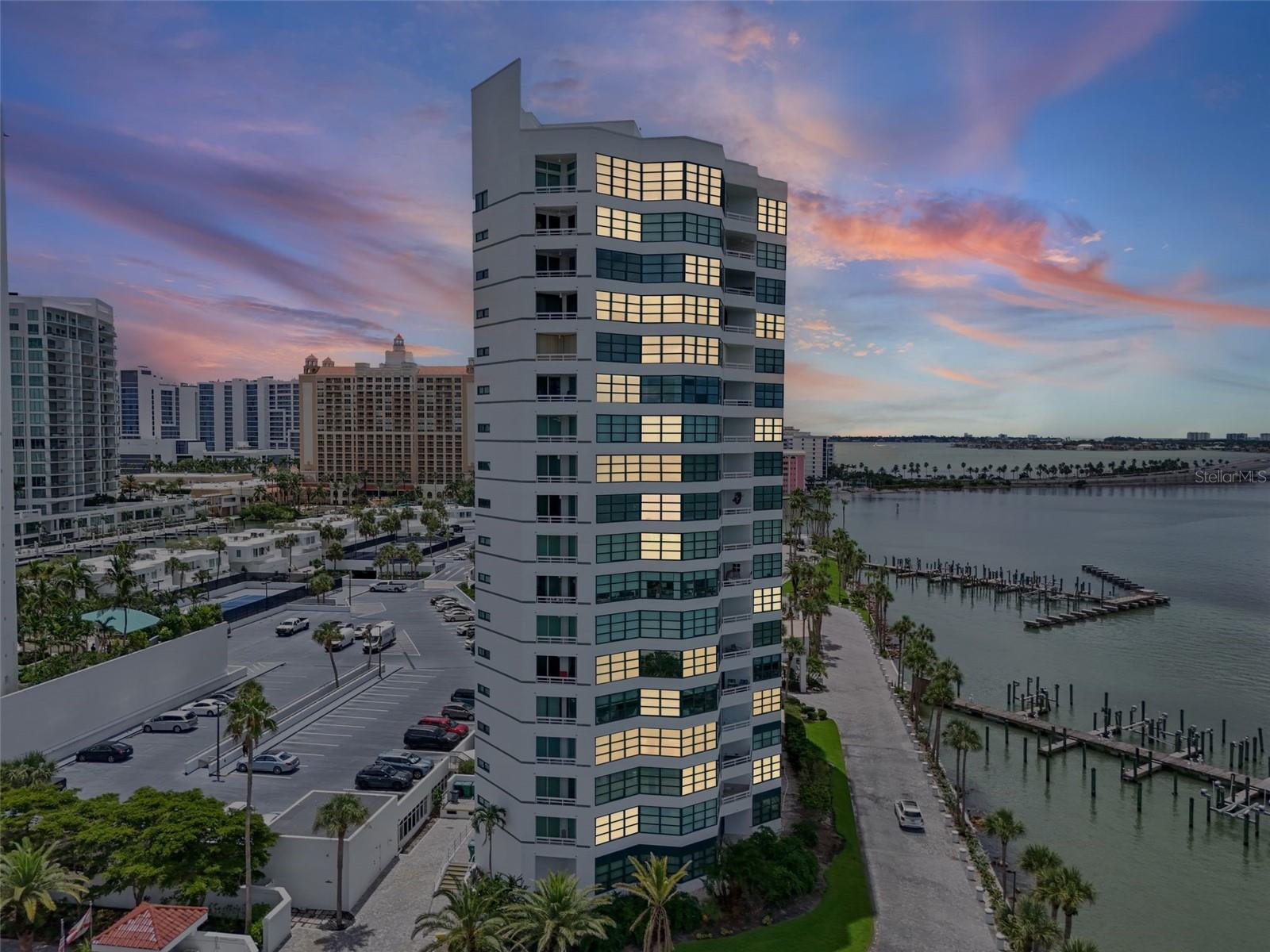 A rare opportunity to own one of Sarasota’s most coveted addresses. This highly desirable corner
residence on the 10th floor of Condo on the Bay offers uninterrupted, forever views from every room.
From sunrise over Sarasota Bay to fiery Gulf sunsets, your panorama will never be blocked thanks to
the building’s premier bayfront position. This fully reimagined residence blends modern elegance with
timeless design. Twenty four inch porcelain tile sweeps throughout, setting the stage for a chef’s kitchen that is
as striking as it is functional featuring custom cabinetry with iron-framed glass front display cases,
sleek quartz countertops, and a full suite of Wolf and Sub-Zero appliances. Hurricane-rated sliding
glass doors frame the water and open to two private balconies for alfresco dining against a stunning
backdrop. The floor plan offers true privacy, with the primary suite showcasing wraparound bay views,
a spa-inspired bath, and generous closets. The guest suite has been redesigned, and  features a luxurious en suite bath and
walk-in closet, creating a second private retreat. Every fixture, finish, and surface has been
hand-selected for both beauty and longevity, delivering a residence that is as functional as it is
breathtaking. Set within one of Sarasota’s most prestigious gated communities, enjoy a resort-style
pool, fitness center, tennis & pickleball courts, boat slips, concierge services, and a beautifully
appointed events room within the tower, complete with a full kitchen for hosting private gatherings.
Added conveniences include garage parking and on-site electric car charging stations, ensuring
modern comfort meets sophisticated living. All of this, mere steps from the cultural heartbeat of
downtown Sarasota, fine dining, galleries, and the world’s finest beaches.