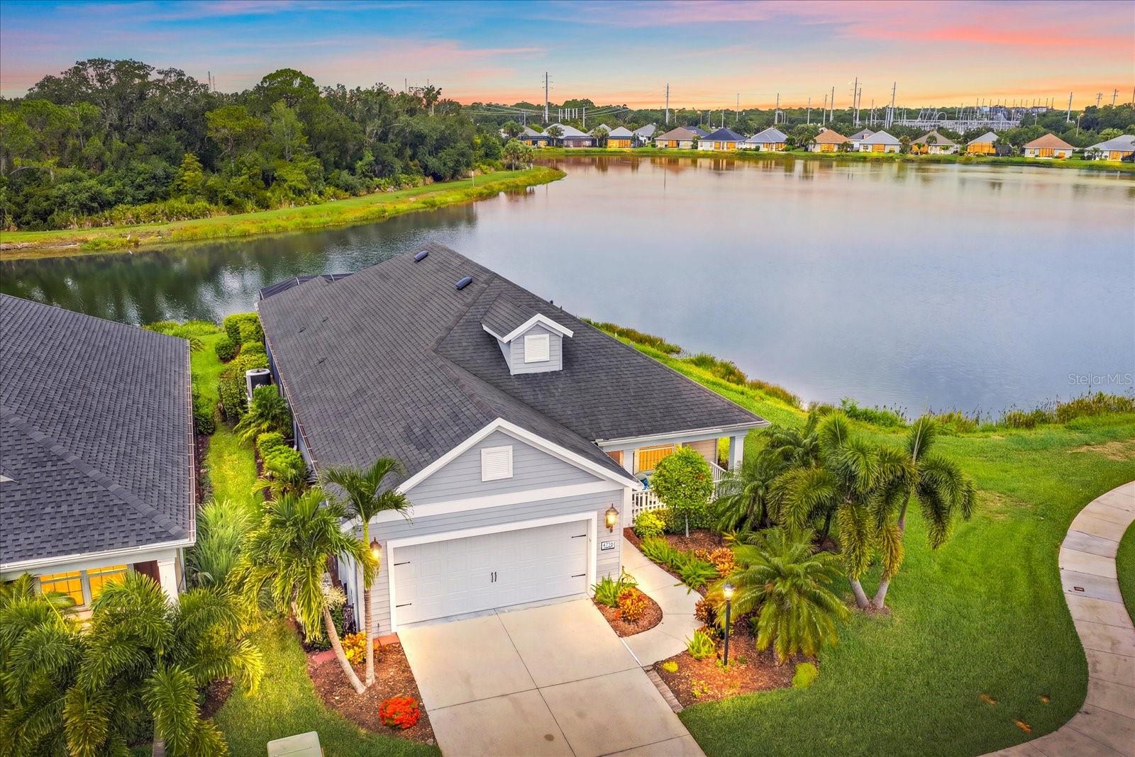 LOCATION, LOCATION, LOCATION! If you've been dreaming of a home that feels like a private waterfront retreat, this is it. Perfectly positioned at the end of a quiet cul-de-sac in the gated community of The Ridge at Crossing Creek, this beautifully maintained home offers an extraordinary setting with water surrounding the property on three sides. Wake up to breathtaking water views, enjoy abundant wildlife from your screened lanai, and experience a level of privacy that's rarely found. It's like living on your own private island while still being just minutes from everything you need.
The BIG-TICKET ITEMS have already been done for you! Recent improvements include~
**NEW HVAC COMPRESSOR (2025)
**NEW POOL PUMP (2025)
**NEW HURRICANE IMPACT WINDOWS (2024)
**NEW HURRICANE-RATED ELECTRIC RETRACTABLE LANAI SCREEN (2024)
**NEW HOT WATER HEATER (2024)
**NEW HVAC UV LIGHT (2024)
**NEW HVAC CAPACITOR & COMPRESSOR SAVER (2024)
**RADIANT BARRIER ROOF SHEATHING
**TWO SOLAR ROOF EXHAUST FANS
**OVERSIZED EXTENDED GARAGE WITH EXTRA STORAGE SPACE
Offering 2,233 square feet of thoughtfully designed living space, this 3-bedroom home with a spacious 12' x 14' flex room also features an oversized extended garage with exceptional storage space. The flex room can easily serve as a home office, media room, fitness room, or fourth bedroom to fit your lifestyle.

The screened lanai is where this home truly shines. Relax while taking in panoramic water views, incredible privacy, and the peaceful sights and sounds of nature. With water wrapping around three sides of the property, every day feels like a vacation.

From the moment you enter The Ridge at Crossing Creek, you'll be welcomed by lush tropical landscaping that sets the tone for this beautifully maintained gated community. Residents enjoy NO CDD, a reasonable HOA, fantastic amenities ~ including a community pool and spa, enjoy fantastic amenities, including a community pool and spa, while being around 12 miles from vibrant downtown Sarasota, only 16 miles from the powder-soft Gulf beaches, and within 20 minutes of more than 80 restaurants, shopping, golf, and everyday conveniences.

Homes offering this level of privacy, spectacular water views, extensive updates, and an unbeatable location rarely become available. LIVE ON VACATION NOW!