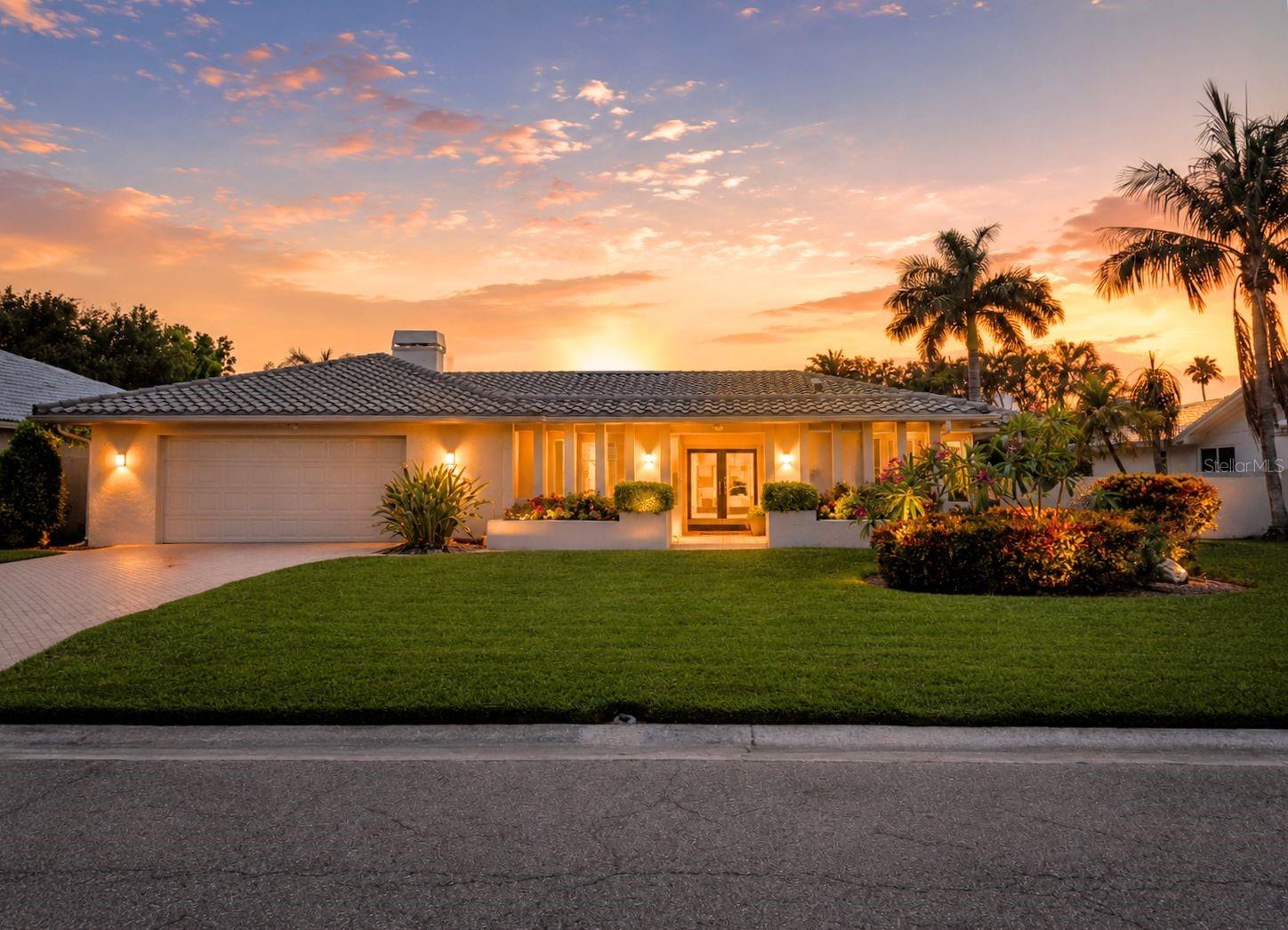 Welcome to timeless elegance in the prestigious gated community of Bayway Isles, where luxury meets peace of mind. Situated on a built-up lot, this exceptional residence remained completely dry during recent storms with **no flooding, no water intrusion, and no storm-related damage**.

Designed for both everyday living and entertaining, this spacious home features **4 bedrooms**, including a flexible bedroom currently used as a home office with custom built-in bookshelves, **2.5 bathrooms**, and a desirable split-bedroom floor plan. The beautifully updated kitchen is the heart of the home, showcasing whitewashed wood cabinetry, expansive countertops, abundant storage, and an open layout that flows seamlessly into the living and dining areas. A separate wet bar makes entertaining effortless.

Natural light fills the home through expansive sliding glass doors that connect the kitchen, living room, and primary suite to the screened pool and lanai, creating a true indoor-outdoor Florida lifestyle. The spacious primary suite offers direct pool access, a spa-inspired bath with a soaking tub, separate glass-enclosed shower, dual vanities, and generous closet space.

Guests are welcomed through a private courtyard entrance, while the fully fenced backyard, mature tropical landscaping, and flowering trees provide exceptional privacy around the screened pool—perfect for relaxing or hosting family and friends.

Recent updates include a **new roof (2016)**, **new HVAC system (2018)**, and an updated kitchen, offering both style and peace of mind.

Perfectly positioned just minutes from the award-winning Gulf beaches, Downtown St. Petersburg, the St. Pete Pier, museums, waterfront parks, fine dining, shopping, and entertainment, this home also offers convenient access to I-275, the Sunshine Skyway Bridge, and Tampa International Airport. Residents enjoy the convenience of Bayway Market, just a short walk or bike ride away, featuring fresh produce, artisanal goods, premium meats, seafood, and everyday essentials.

Whether you're searching for a full-time residence or a luxurious Florida retreat, this beautifully maintained Bayway Isles home offers an exceptional combination of location, lifestyle, and lasting value in one of St. Petersburg's most sought-after waterfront communities.