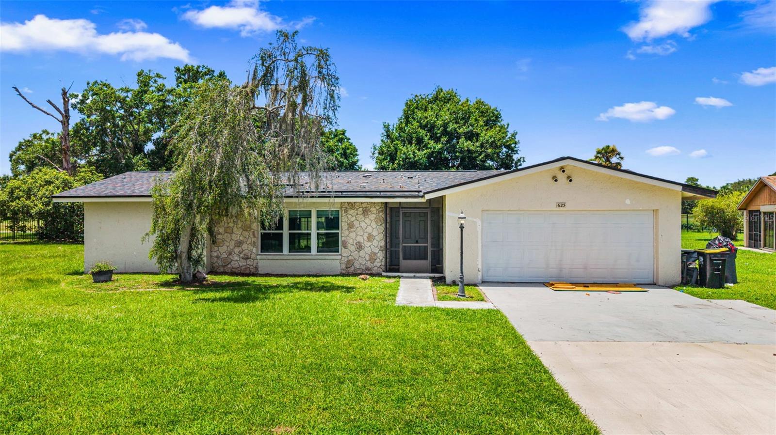 Short Sale. Incredible Opportunity to Build Equity! Welcome to this spacious 3-bedroom, 2-bath home with a 2-car garage, offering nearly 1,700 square feet of living space on an oversized 0.36-acre lot in the established Poinciana Villages community. Featuring a desirable split-bedroom floor plan, generously sized living and dining areas, large primary suite with a walk-in closet, and a covered screened patio overlooking the expansive backyard, this home provides a fantastic foundation for its next owner. The large lot offers endless possibilities for outdoor entertaining, gardening, or creating your own backyard oasis.

While the property does need TLC, it presents an outstanding opportunity for investors, flippers, or owner-occupants looking to customize a home and build instant equity. With the right vision and updates, this property has tremendous potential.

Residents of Poinciana enjoy access to community parks, playgrounds, sports fields, basketball and tennis courts, fitness centers, walking trails, dog parks, and neighborhood events through the Poinciana Villages Association. Conveniently located near schools, shopping centers, restaurants, medical facilities, and the Poinciana Parkway, you'll enjoy an easy commute to Kissimmee, Lake Wales, Orlando attractions, and Central Florida's major employment hubs. Whether you're looking for a primary residence, vacation home, or investment property, this location continues to see strong demand.

Property is being sold AS-IS. This is a Short Sale, and the bank has not approved the listing price. The final purchase price and terms are subject to lender approval. Buyers should expect additional time for lender review and approval. Don't miss this chance to transform this home into something truly special while taking advantage of one of Central Florida's best values.