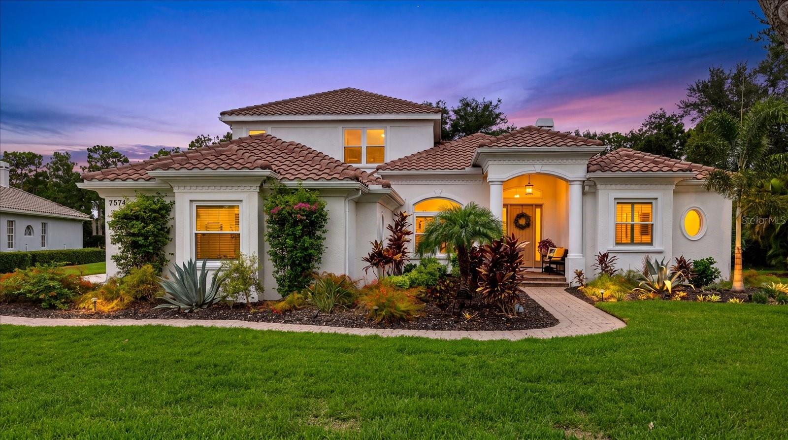 Welcome to your private River Club sanctuary in the heart of Lakewood Ranch. Perfectly positioned on nearly a half-acre homesite within the highly coveted and exclusive Sanctuary section of River Club, 7574 Tori Way offers a rare combination of privacy, luxury, and convenience—an increasingly difficult find in today's market.
Designed for the Florida lifestyle, this completely renovated residence feels like a private retreat surrounded by mature landscaping, tranquil green space, and exceptional privacy. Begin your mornings with coffee beside the sparkling pool, spend afternoons entertaining on the expansive lanai, and unwind in the evenings with the doors open to gentle breezes and peaceful views. Upstairs, a private balcony overlooking the trees provides the perfect escape to relax and enjoy the serene setting. While the home offers the feeling of a secluded sanctuary, it remains just minutes from everything that has made Lakewood Ranch one of Florida's most desirable communities.
Inside, the thoughtfully designed floor plan offers both comfort and flexibility. The primary suite is privately situated on the main level alongside a second bedroom and full bath, a dedicated office, and spacious living and dining areas that seamlessly connect to the outdoor living spaces. Upstairs, an expansive bonus room with its own private balcony creates endless possibilities as a media room, game room, guest retreat, or additional living space. Two additional bedrooms and a full bath complete the upper level, making it an ideal layout for guests or multigenerational living.
Since 2021, the home has undergone an extensive transformation with high-quality upgrades throughout, providing exceptional peace of mind for its next owner. Significant improvements include a new tile roof (2024), more than 25 impact-rated windows and doors, a whole-home generator, new AC, remodeled guest bathroom, updated flooring, refreshed kitchen and primary bath cabinetry, new exterior paint, professionally designed landscaping, upgraded exterior lighting, whole-house gutters, updated soffits and fascia, new garage doors, and a new front entry door.
The outdoor living experience has been equally enhanced. The pool has been resurfaced and retiled, complemented by a new pool heater, updated pool equipment, new patio pavers, and a refurbished and rescreened pool cage. Two covered lanais, combined with an expansive pool deck, create multiple spaces for entertaining family and friends or simply enjoying Florida's year-round outdoor lifestyle. The result is a private backyard oasis that perfectly blends relaxation and recreation.
Additional highlights include a spacious three-car garage, natural gas service, no flood zone designation, and NO CDD fees. The location offers unmatched convenience, just minutes from Lakewood Ranch Main Street, Waterside Place, University Town Center, championship golf courses, parks, walking trails, world-class shopping and dining, downtown Sarasota, Bradenton, and the beautiful Gulf Coast beaches. Frequent travelers will also appreciate the home's close proximity to Sarasota-Bradenton International Airport (SRQ), located approximately 20 minutes away.
Rarely does a home combine this level of privacy, extensive renovation, premium location, and modern peace of mind. 7574 Tori Way offers an exceptional opportunity to enjoy the space, setting, and lifestyle buyers seek within one of Lakewood Ranch's most established and sought-after communities.