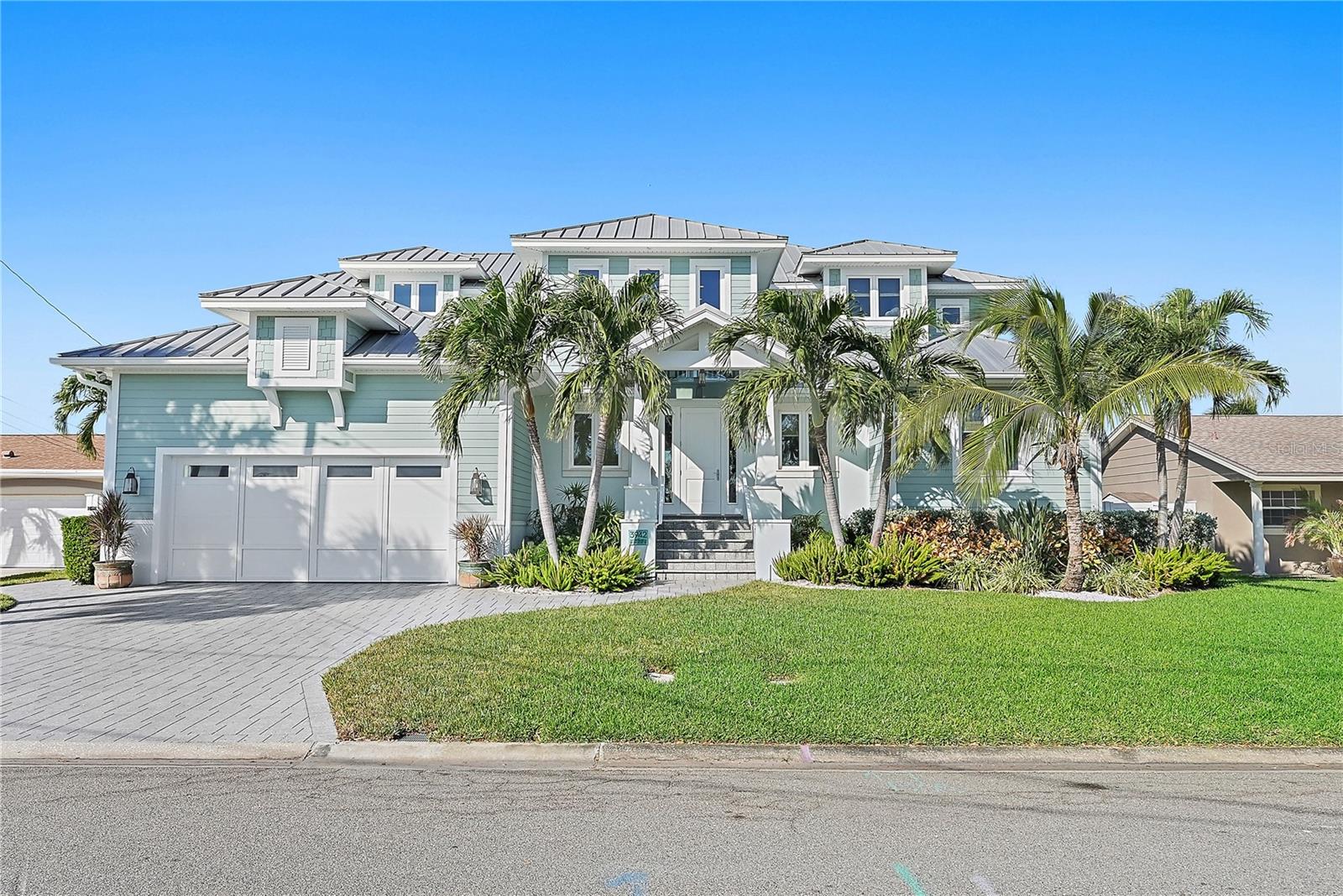 Thanks to its high elevation and durable construction, this extraordinary waterfront home has withstood Florida's recent hurricanes without damage. Flood insurance is an incredible value at just $1,000 per year.

Located in the sought-after Patrician Point neighborhood, this custom-built home is just minutes from downtown St. Petersburg, accessible by bike or car. Built in 2014 by the renowned Deslandes Contracting Inc., this two-story concrete home combines modern luxury with exceptional durability, offering the perfect balance for coastal living.

The interior boasts generous, light-filled living spaces with a seamless flow from room to room. At the heart of the home is a chef’s kitchen that stands out for its top-of-the-line appliances, including a 48-inch Sub-Zero refrigerator and freezer, a 36-inch dual-fuel Wolf range, a Wolf microwave drawer integrated into the island, a Thermador dishwasher, and a 15-inch Uline wine refrigerator. Just off the kitchen, the stylish and highly functional laundry room features a Thermador refrigerator column, a Uline ice maker, and LG washer and dryer sets on pedestals.

The backyard is a true haven for entertaining and relaxation. The outdoor kitchen, equipped with a Viking natural gas grill, premium exhaust hood, and Uline refrigerator, is perfect for hosting gatherings. The heated saltwater pool and spa offer year-round enjoyment, complete with a pebble sheen finish, sun shelf, and vibrant LED lighting that creates an inviting ambiance day or night.

For boating enthusiasts, the property features dual boat lifts—one with a 16,000-pound capacity and another with a 6,000-pound capacity—providing convenient access to Tampa Bay.

This home was built with resilience and energy efficiency in mind. PGT impact-rated windows and sliders, Icynene spray foam insulation, two natural gas on-demand water heaters, and a whole-house natural gas generator ensure both comfort and peace of mind. The 24-gauge standing seam Galvalume roof adds sleek architectural style and unmatched durability.

With 10-foot ceilings on the main floor, 9-foot ceilings upstairs, second-story block construction, and LED lighting throughout, every detail has been carefully planned. The oversized garage and rear storage area offer ample space, while the upstairs balcony provides breathtaking views of downtown St. Petersburg—a perfect spot for morning coffee or evening relaxation.

This is your chance to own a home that redefines luxury waterfront living. Whether you are entertaining friends, enjoying quiet moments by the pool, or heading out for a day on the water, this property offers it all.

Don’t miss the opportunity to make this dream home yours!