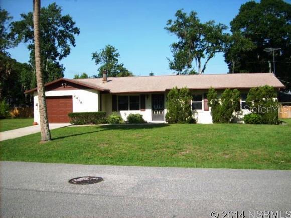 Cute block/stucco 3/2/1 in Florida Shores with nicer living room and wood burning fireplace. Dining room off kitchen with sliders out to a new screened porch. Nicer ceiling fans in each room and a new roof in 2011. Plenty of room in the back yard for a pool! Work shelf in garage! ;Water: City