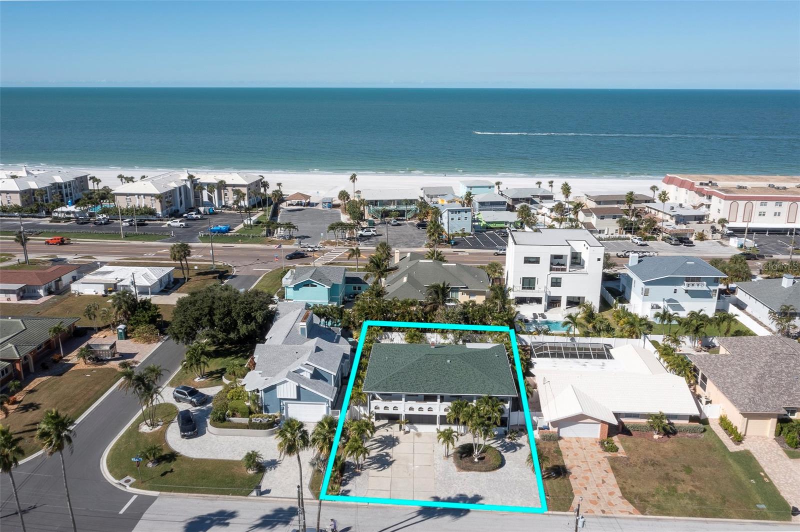 Virtually Staged. STUNNING, *ELEVATED* BELLEAIR BEACH HOME ONE BLOCK TO THE BEACH! New roof, windows, & kitchen, bathrooms, & flooring updates -- all in 2023. Now offered at $1,182,000. What if you could embrace a life of coastal elegance, just moments from the Gulf and the white-sand beaches of Belleair Beach’s exclusive, private community? That’s exactly what this exceptional coastal estate delivers. Designed with a perfect balance of sophistication and comfort, this is a peaceful retreat for everyday living that can also effortlessly accommodate gatherings with family and friends. Picture quiet mornings with coffee on the balcony taking in the salt-kissed breeze, followed by evenings filled with laughter as kids and grandkids gather downstairs. The beautifully appointed kitchen serves as the heart of the home, featuring a striking waterfall island, built-in wine fridge, and generous space for lingering over slow weekend breakfasts and meaningful family moments. Throughout, refined finishes elevate the experience—designer tilework, LED mirrors, floating vanities, and sleek fixtures create a cohesive, modern aesthetic. A central vacuum system, separate laundry room, expansive storage, and garage space add ease and practicality to daily life. Two spacious balconies invite seamless indoor-outdoor living, while the versatile ground level offers exceptional flexibility—ideal for a media lounge, hobby or craft room, home gym, or creative studio (within building codes). Step outside to a backyard that feels like your own private retreat. Framed by palms, fruit trees, and a stunning pergola, the space offers the perfect balance of sun and shade—an inviting canvas ready for your dream outdoor oasis. With abundant parking, distinctive architectural character, and endless potential, this Belleair Beach gem is more than a home—it’s a peaceful coastal sanctuary where memories are made and generations gather. All that’s missing is you.