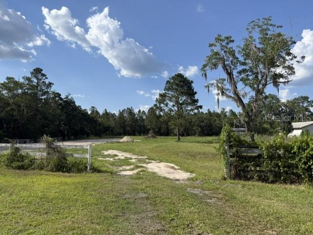 One of the last large tracts available inside the City of Lake Butler! This rare 3.8-acre parcel offers endless possibilities whether you’re dreaming of a private estate, a family compound, or exploring the potential to subdivide (subject to city approval). Fill dirt has already been brought in to help prepare the site, saving time and expense. With city utilities nearby, paved road frontage, and a location just minutes from Lake Butler Lake, the public boat ramp, splash park, schools, and downtown, this property combines the convenience of in-town living with the space and privacy that’s almost impossible to find. Don’t miss this unique investment opportunity in one of North Florida’s most charming small towns.