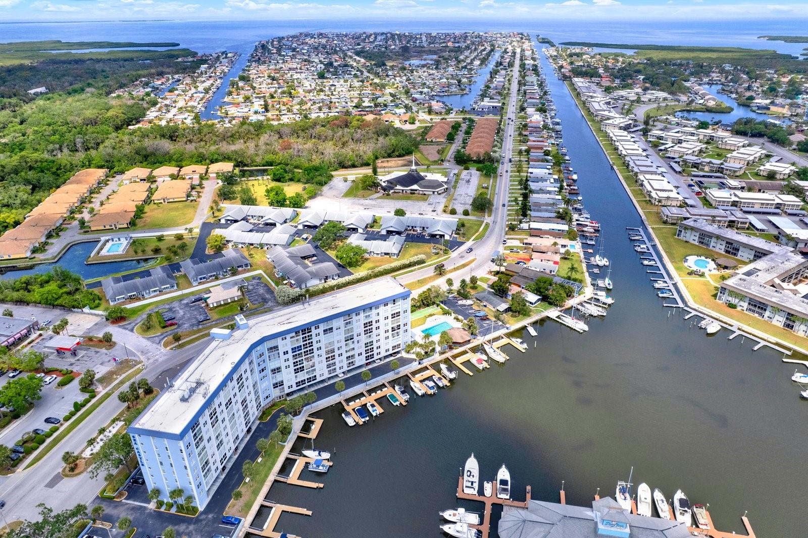 Amazing opportunity to live the salt life! This 2 bedroom 2 bath condo unit includes a huge swimming pool, BBQ & outdoor kitchen, boat/RV storage, private beach available (additional $200 per year), low HOA $729.29 includes water, trash, pest management, exterior maintenance, building maintenance, insurance, common area, WIFI, secure building, and management. Golf cart friendly neighborhood. Fishing dock. No age restrictions. Can rent after 2 years ownership, no short term rentals. Solid financials, no assessments scheduled, solid investment in a waterfront community. Schedule your showing!