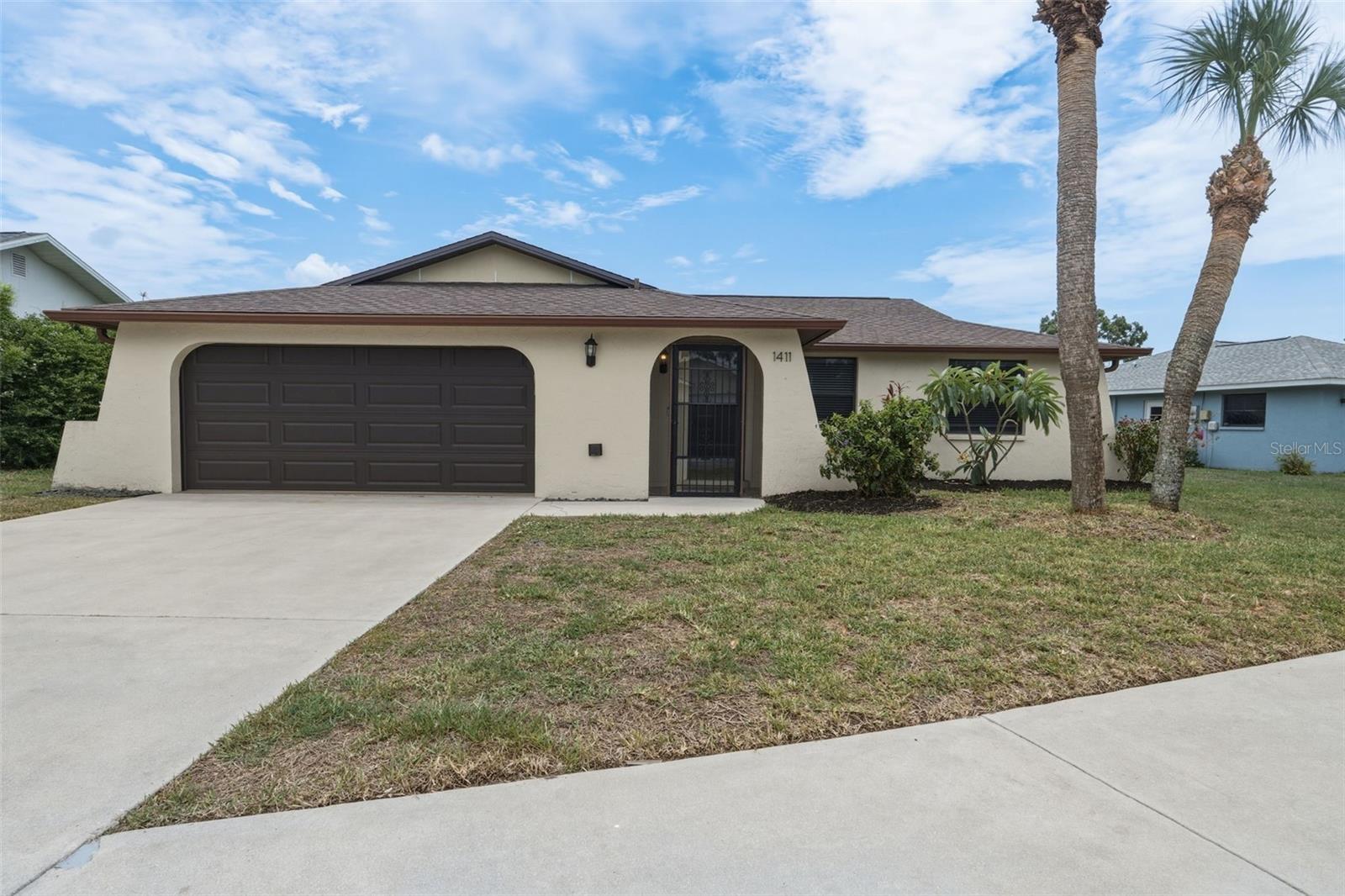 Welcome to this two bedroom + den, two bath residence, in the Carlentini neighborhood at Capri Isles! This unique property is perfectly positioned near the end of a quiet cul-de-sac, backing to the Capri Isles golf course—a rare setting at this price! NEW ROOF 2023! This move-in-ready home offers light-filled living spaces, a functional split-bedroom floor plan, a 2 car garage, and even a wood-burning fireplace! The kitchen features white cabinets and a pass thru window to the living room. The master suite is past the dining room & office and has a walk-in closet and plenty of room for a king-sized bed. The 2nd bedroom is roomy and can also fit a king sized bed. Entrance to the office is located near the front of the home. This space could also be a nursery or playroom. The wall of sliding glass doors in the living room leads to your very own screened-in lanai with views of the golf course. The owners have done quite a few updates to the home to include new luxury vinyl plank floors throughout, popcorn ceiling removal, new lighting, new interior paint, new garage door in 2023, new side garage door in 2023, new roof in 2023, new electrical panel in 2022, and new screened porch in 2023. The AC was installed in 2021. The optional HOA is just $10 per year. There is no CDD fee in this community and it is located in an X flood zone so no need for flood insurance! This neighborhood is only 5 minutes from I-75, 5 minutes from the Sarasota Memorial Hospital (Venice Campus), and just a short drive to Venice Island, with it's beaches, charming boutique shops, dining options, Venice Little Theater, fishing pier, tennis courts, weekly farmer’s market, tons of events, and so much more! Don’t miss the opportunity to make this exceptional property your new home!