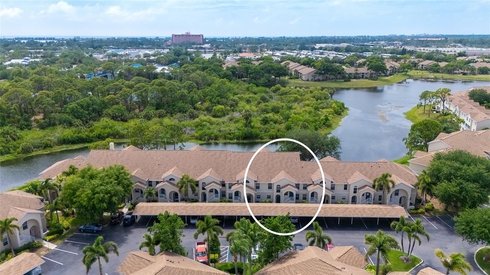 Have you been waiting to find that perfect lakeview condo?   This great 2 bed/2 bath condo at Pinestone is the perfect home for nature lovers!
From the screened lanai, you can enjoy birdwatching and an occasional alligator sighting!  Grilling is allowed on your personal patio. Add some colorful flowers and plants to make it your own outdoor oasis. Enjoy water views from your open plan kitchen, dining, and living areas and your master bedroom as well.
This unit is being sold turnkey furnished with fun Florida Style furniture and decor.  It is carpeted though out except for the ceramic tile in the kitchen and bathrooms.  The current formica cabinets are older but in good condition and several appliances are newer.  There are several large closets and a large storage room adjacent to the entry which is great for your beach gear, bikes, and other items. This condo is being sold AS-IS.  
Pinestone at Palmer Ranch is known for its amenities and social calendar.  Enjoy swimming in the Olympic style heated pool, or get active on the tennis and pickleball courts. There is a 32- seat movie theater for private showings of movies and sports. The nearby Legacy Bike Trail is popular with bikers and walkers.  Siesta Key and Venice are just 15 minutes- drive time.  This location is ideal for quick access to Costco, Kohls, Target, Publix , Lowes and many great restaurants.  If you are ready to live the Florida resort lifestyle this community and this condo could be perfect for you.  Call for a private showing.