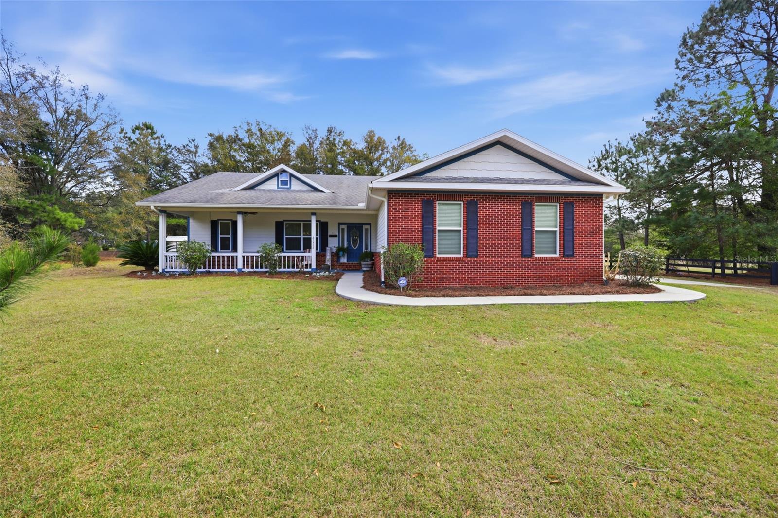 Check out this beautiful 2019-built 3 bedroom, 2 bathroom home situated on nearly 7 acres in the charming town of High Springs! Enjoy peaceful country living while still being just minutes from town. Inside, you'll find vaulted ceilings that create an open feel with plenty of cubic space. The home features carpet and vinyl plank flooring, making maintenance a breeze. The modern kitchen offers stone countertops and stainless steel appliances, perfect for cooking and entertaining. Relax on the covered front porch or enjoy the outdoors from the fully screened back porch. The property also includes pasture areas ideal for horses or animals and a private fish pond in the backyard, adding to the property's peaceful setting. Conveniently located less than 10 minutes to High Springs, 15 minutes to Alachua, 20 minutes to Gainesville, and 25 minutes to Lake City, this home offers the perfect balance of country living with easy access to nearby towns. Schedule your private tour today — this one will not last long!