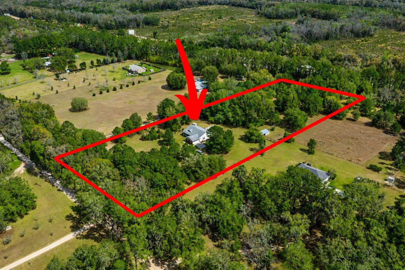 Check out this beautiful 2019-built 3 bedroom, 2 bathroom home situated on nearly 7 acres in the charming town of High Springs! Enjoy peaceful country living while still being just minutes from town. Inside, you'll find vaulted ceilings that create an open feel with plenty of cubic space. The home features carpet and vinyl plank flooring, making maintenance a breeze. The modern kitchen offers stone countertops and stainless steel appliances, perfect for cooking and entertaining. Relax on the covered front porch or enjoy the outdoors from the fully screened back porch. The property also includes pasture areas ideal for horses or animals and a private fish pond in the backyard, adding to the property's peaceful setting. Conveniently located less than 10 minutes to High Springs, 15 minutes to Alachua, 20 minutes to Gainesville, and 25 minutes to Lake City, this home offers the perfect balance of country living with easy access to nearby towns. Schedule your private tour today — this one will not last long!