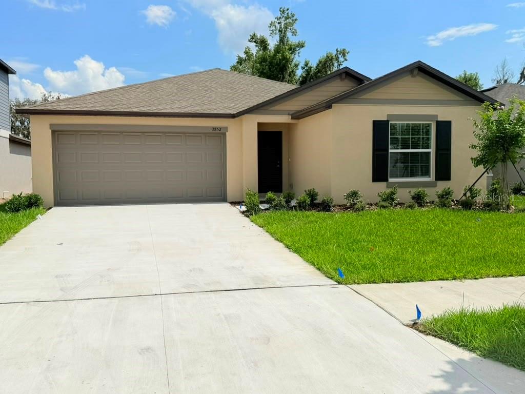 Welcome to Brand new beautiful 4-bedroom, 2-bath ranch-style home with beautiful pond view, nestled against a serene, wooded backyard that offers both privacy and space for the lifestyle you deserve. This single-story home features an open-concept floor plan where the family room, dining area, and kitchen seamlessly come together—perfect for everyday living and entertaining. Tucked away from the three secondary bedrooms, the peaceful owner’s suite includes a spa-like private bathroom designed for relaxation and comfort. A two-car garage completes the home, providing ample space for storage and versatile needs. Enjoy resort-style community amenities, including a pool, playground, basketball court, pickleball court, and lake access for endless weekend fun. Ideally located just minutes from South Florida Baptist Hospital, downtown Plant City, shopping, dining, and major roadways, this home offers the perfect blend of comfort, convenience, and community living. Homes like this don’t last long—schedule your private showing today and experience it for yourself before it’s gone.