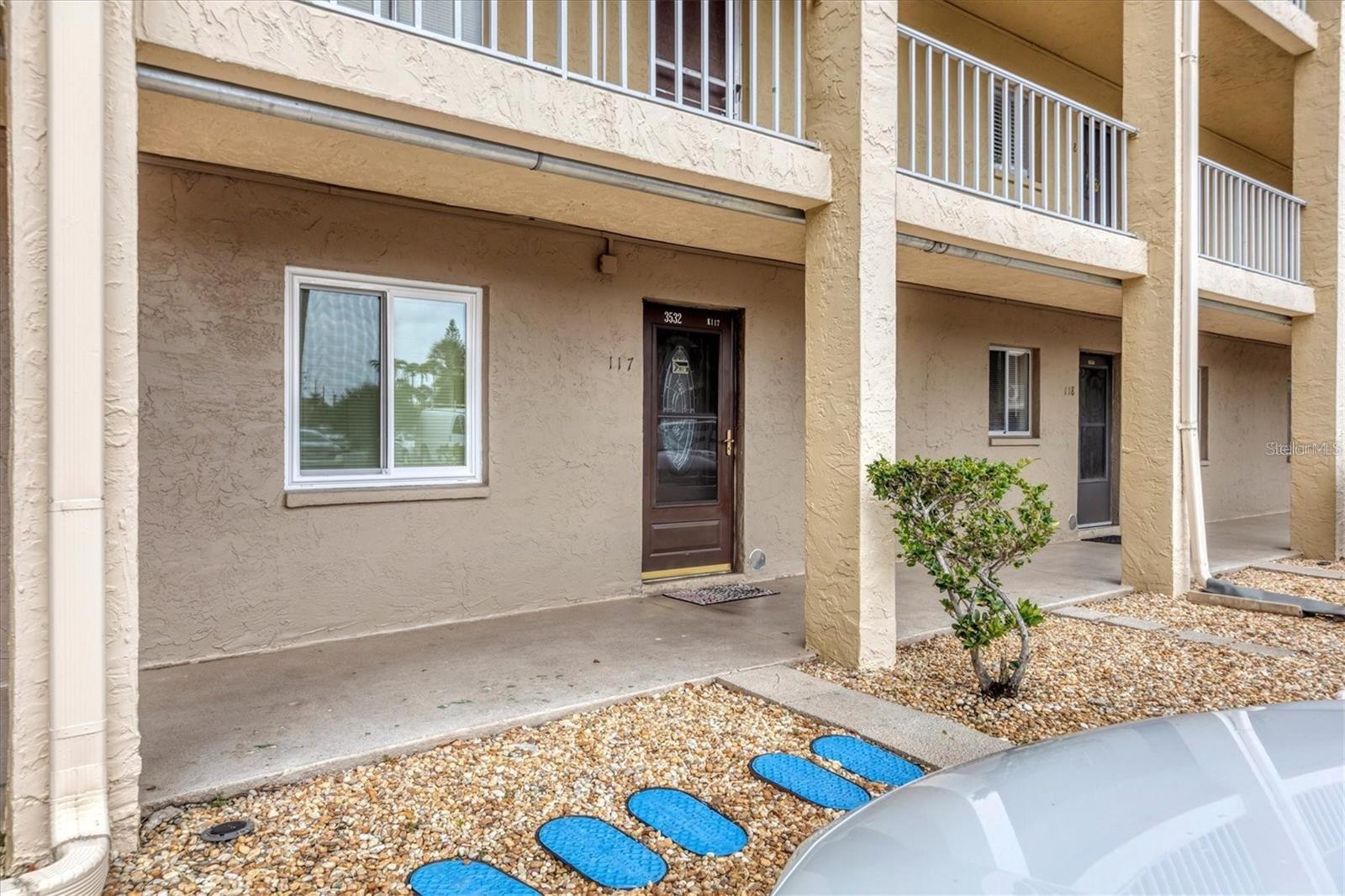 Short Sale. Ground Floor Condo in Beautiful Bayshore on the Lake 55+ community in Bradenton. Your parking is right in front of your door. FULLY FURNISHED. The open floor plan features a tiled foyer, a spacious living room with sliders leading to an all-tiled enclosed lanai.