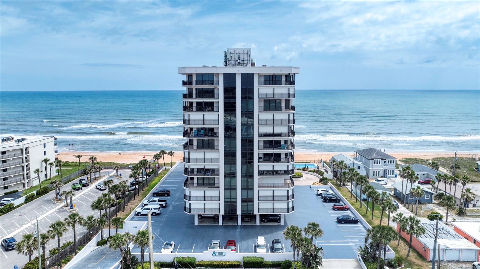 ON THE SAND at the luxurious Gemini condominium in the heart of Ormond-by-the-Sea! Offering breathtaking ocean views from every room, true floor to ceiling windows and sliding glass doors. The Gemini engineering inspections and reserve study are complete, with the budget showing abundant reserves. It's rare to come across a building that's better maintained. In fact, they reduced the monthly HOA fees.. This 1699 sqft retreat has been completely remodeled with granite counters throughout, solid wood dovetail custom cabinetry, GE stainless steel appliances, cohesive LVP flooring, modern LED lighting and electrical switches, built-in bar with accent lighting, electric hurricane shutters and more. . The spacious primary suite features a private balcony, walk-in closet, and a luxurious bathroom. The bright kitchen provides ample counter space and a walk-in pantry. This turnkey residence combines luxury, comfort, convenience, and peace of mind. The pet-friendly Gemini features incredibly-maintained facilities and amenities including beachside pool and deck overlooking the ocean, spas, exercise facility with ocean views, large community room with library and game room. Located within walking distance to grocery shopping, dining, and entertainment. Just over an hour to Orlando International Airport and 20 minutes to Daytona International Speedway this unit is unmatched