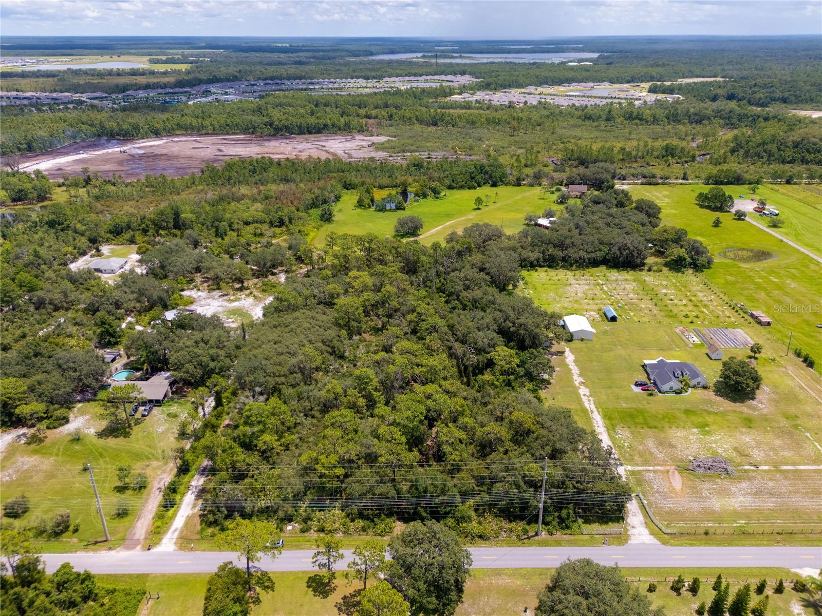 Buildable Parcel, Just Under 5 Acres by Lake Nona Medical City.   Surging demand in the Lake Nona / St. Cloud innovation corridor is making near-5-acre buildable tracts increasingly scarce. Secure a strategic position in Central Florida’s next chapter, where expanding infrastructure, high-quality jobs, top-tier healthcare, and lifestyle amenities meet rapid housing demand.  Just under 5 acres of buildable land located 10 minutes south of Lake Nona’s Medical City in St. Cloud, FL. Surrounded by major master-planned communities, Sunbridge, Weslyn Park, Preston Cove, and Roan Bridge, this parcel is ideal for developers, builders, investors, or a private luxury estate. Utilities are nearby, streamlining the path from concept to construction. Whether your vision is a small residential enclave, custom luxury homes, or a long-term land hold in a high-growth market, this site delivers location, scalability, and future upside.