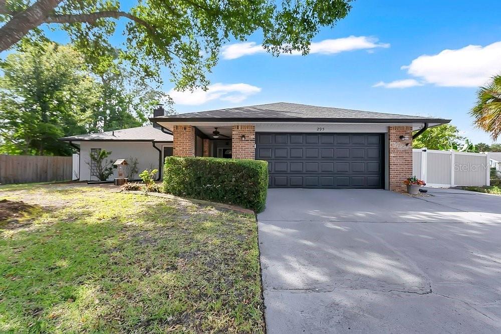 Welcome to your private Florida retreat in the highly desirable Sterling Park community — where upgraded comfort, entertaining space, and everyday convenience all come together in this beautifully updated 3 Bedroom / 2 Bathroom home situated on a quiet cul-de-sac corner lot.

Designed with comfort and functionality in mind, this desirable SPLIT FLOOR PLAN offers added privacy with a spacious owner’s suite separated from the guest bedrooms — creating the perfect layout for families, guests, remote work, or multigenerational living.

From the moment you arrive, the mature landscaping, oversized driveway, ranch-style curb appeal, and newer vinyl fencing create a warm and inviting first impression. Step through the enclosed front porch into a bright OPEN-CONCEPT layout designed for both relaxing and entertaining.

At the heart of the home, a stunning wood-burning fireplace anchors the main living area, while the formal dining space and oversized living room flow seamlessly together under recessed lighting and abundant natural light. French doors with built-in blinds open to your true OUTDOOR OASIS — an oversized covered lanai added in 2019 that creates the perfect indoor/outdoor Florida lifestyle experience.

The kitchen was designed with both function and style in mind and will impress any home chef with its professional gas stove top, dramatic beautiful stone countertops, solid wood cabinetry, slow-close drawers, breakfast bar island, pantry storage, newer appliances, and open sightlines overlooking the living and dining spaces. Entertaining is effortless with the built-in wet bar and wine cooler ready for gatherings year-round.

Privately positioned away from the secondary bedrooms, the spacious owner’s suite feels like a true retreat with room for a California King bed, a large walk-in closet with custom built-ins, and a beautifully remodeled spa-inspired bathroom featuring dual vanities, upgraded fixtures, oversized glass-enclosed tiled shower, dual shower heads, and a luxury rain shower feature.

Additional upgrades and features include:

Roof replaced in 2023
 House generator connection
Tankless water heater (2019)
Water softener
Luxury wood-look vinyl flooring
Newer window treatments throughout
Lawn irrigation system
Attic fan
Gas connection
Washer & dryer included
Newer appliances (within last 2 years)
EV Charger in Garage

The fully fenced backyard offers privacy and flexibility with plenty of room to create your dream outdoor lifestyle — whether you envision adding a future custom pool, creating an outdoor kitchen and entertaining area, or designing your own private vegetable and herb garden oasis. There is ample space to truly personalize the outdoor living experience while still enjoying room to relax, play, and entertain.

Located in Sterling Park, residents enjoy access to community amenities including pool, tennis courts, playgrounds, sidewalks, golf nearby, and deed-restricted community living — all with convenient access to shopping, dining, parks, major roadways, and the greater Orlando area.

This is the kind of home buyers walk into and immediately picture themselves living in. Schedule your private showing today.