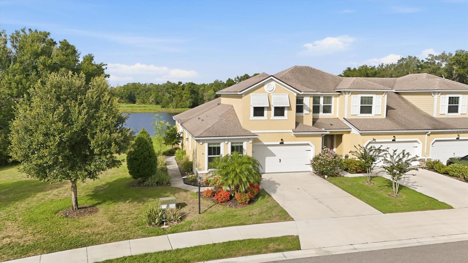 Experience effortless Florida living in this beautifully appointed 3-bedroom, 3-bathroom townhome in the sought-after Harmony community of Lakewood Ranch, offered furnished and move-in ready. With 1,728 square feet of thoughtfully designed living space, stunning water and preserve views, and a new HVAC system, this home combines comfort, style, and peace of mind. The open-concept main living area is designed for both everyday living and entertaining, featuring abundant natural light and picturesque views that create a serene backdrop throughout the home. The kitchen is a standout with stone countertops, neutral cabinetry, and a functional layout that blends elegance with practicality. The spacious primary suite is conveniently located on the first floor and serves as a private retreat, complete with a large walk-in closet and an en-suite bath featuring modern finishes, generous storage, and a walk-in shower. A second bedroom and full bath on the main level allow flexibility for guests, a home office, or additional living space. Upstairs, you'll find a versatile loft ideal for a media room, game room, or second living area, along with a third bedroom and full bathroom, providing privacy and comfort for family and visitors. Spacious additional attic storage adds even more functionality. This home is enhanced with numerous upgrades, including custom roman shades, and electric hurricane-rated roller shutters for the lanai. Every detail has been thoughtfully selected to enhance convenience and style. Residents of Harmony enjoy access to exceptional amenities, including a resort-style pool, fitness center, clubhouse, and scenic walking trails. Ideally located near University Town Center's premier shopping and dining, Mote Marine Laboratory & Aquarium, LECOM, and the world-renowned beaches of Siesta Key, Lido Key, and Anna Maria Island, this home offers the perfect blend of luxury, location, and lifestyle. Don't miss this opportunity to own a beautifully upgraded home in one of the nation's most desirable master-planned communities. Schedule your private showing today.