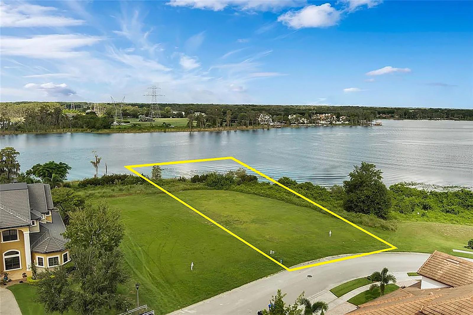 An exceptional opportunity to build your custom estate on this 1.20± acre vacant corner lot with lake views, located at Emerson Pointe at Bay Hill enclave. The property fronts Lake Tibet, the second-largest lake on the renowned Butler Chain of Lakes, offering privacy, prestige, and access to one of Central Florida’s most sought-after waterfront lifestyles. Lake views and frontage along Lake Tibet, part of the Butler Chain of Lakes. 24-hour guard-gated neighborhood surrounded by luxury custom homes. Minutes from Arnold Palmer's Bay Hill Golf Club and Bay Hill Marina. Close proximity to Restaurant Row, premier shopping, and entertainment. Convenient access to I-4, Florida’s Turnpike, and major Orlando attractions. Lot House Ready Summer 2027.