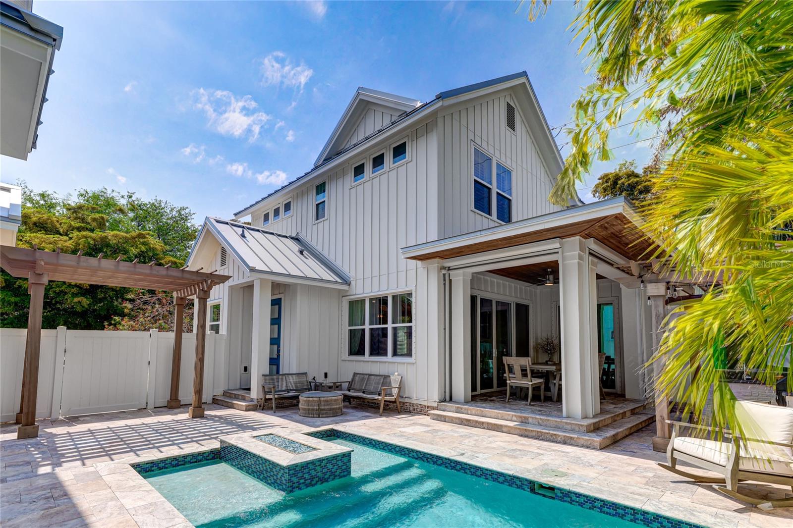 Welcome to 505 South Osprey Avenue, a stunning property located in the picturesque and historic neighborhood of Laurel Park, right in the heart of Downtown Sarasota. This exceptional residence offers a unique lifestyle, reminiscent of a private compound within the city's core. Featuring a main house, guest house, two-car garage, and an enchanting outdoor entertainment space, this property promises a truly unparalleled living experience.

As you enter the main house, you will be captivated by the open floor plan that highlights a chef's kitchen equipped with top-of-the-line appliances, including a Thermador wine cooler and Bosch coffee machine. The kitchen flows seamlessly into the great room, which is adorned with wood plank ceilings and a 42-inch linear gas fireplace, creating a warm and inviting atmosphere. Adjacent to the kitchen and great room is a separate dining room with a coffered ceiling and floor-to-ceiling windows, providing a beautiful setting for entertaining guests with an abundance of natural light.

One of the home's most distinguished features is the rare inclusion of a FIRST-FLOOR primary bedroom and bathroom, offering convenience and sophistication. This primary suite boasts soaring ceilings, a spacious walk-in closet, and luxurious spa-like bath amenities, offering a tranquil retreat for relaxation.

Upstairs, a private bonus/media room provides ample space for leisure activities, while two additional bedrooms with en-suite baths ensure comfort and privacy for family or guests. Adding to the charm of this residence is the fourth bedroom, located above the garage in the in-law suite. This suite offers a Uline beverage center, private bath, and a delightful balcony, exuding comfort and hospitality.

The indoor/outdoor living experience of this home is exceptional. The great room features sliders that open to the covered lanai, where electronic floor-to-ceiling screens allow for a seamless integration of indoor and outdoor spaces. The natural-toned travertine deck leads to a refreshing pool and a heated spa, perfect for daytime relaxation or evening enjoyment. The outdoor summer kitchen, fully equipped for culinary adventures, invites cooking and dining under the sun or stars.

Discover why 505 South Osprey Avenue is one of the most unique and desirable homes in one of Florida's finest locations, Downtown Sarasota. This property is not just a home, but a lifestyle waiting to be experienced.